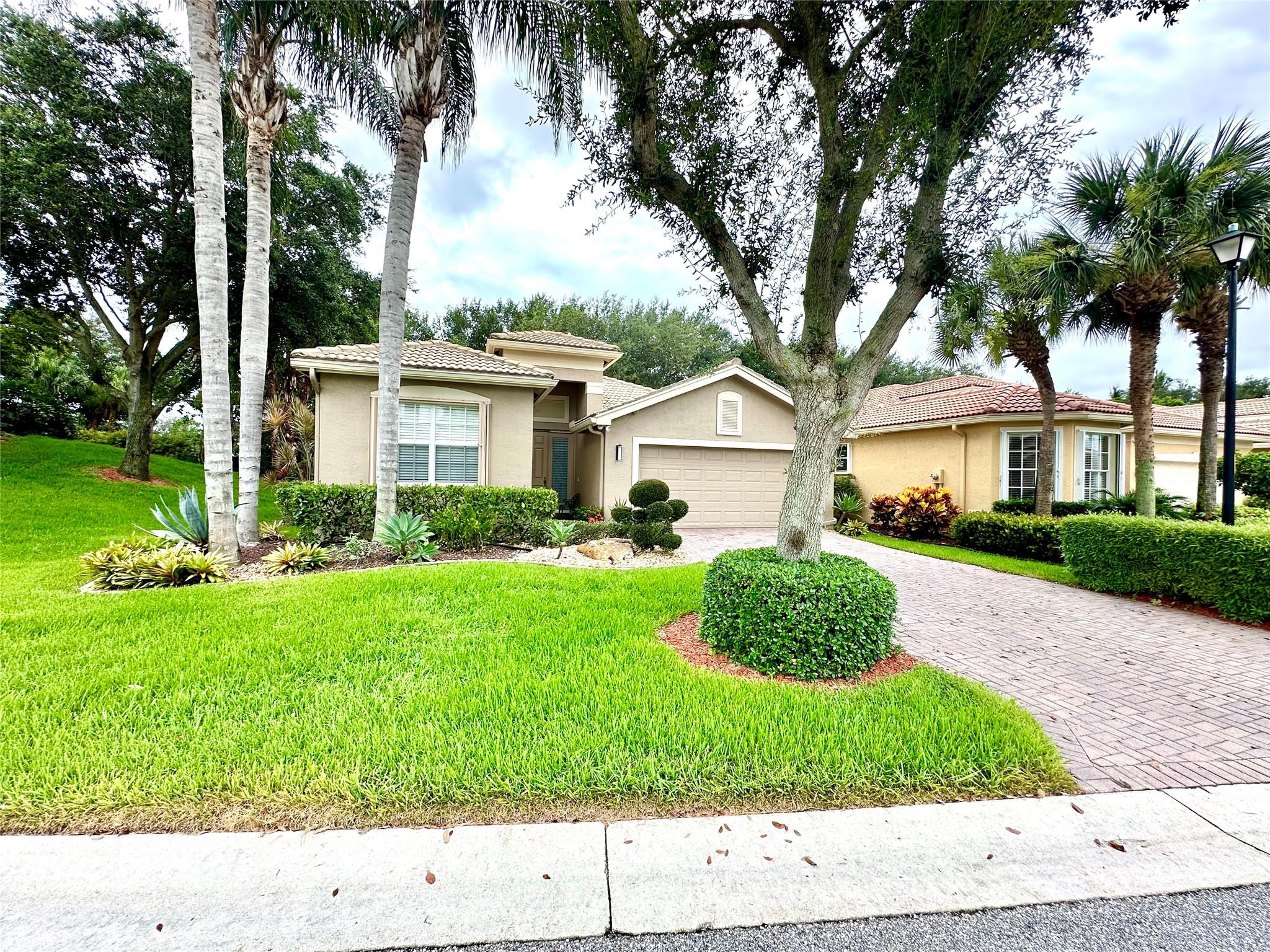 Well maintained "Sophia" model in highly desirable Valencia Pointe by GL Homes. This updated 2-bedroom+den residence features many nice upgrades including new luxury vinyl wood flooring, updated kitchen with quartz counters and new stainless steel appliances, volume ceilings, crown molding, recessed lighting, formal dining area, walk in closet, two-car garage and much more. Enjoy the best of 55+ living at Valencia Pointe with a recently updated luxury clubhouse and lifestyle center, resort style pool, pickleball, tennis and bocce ball, active social events and special interest clubs.