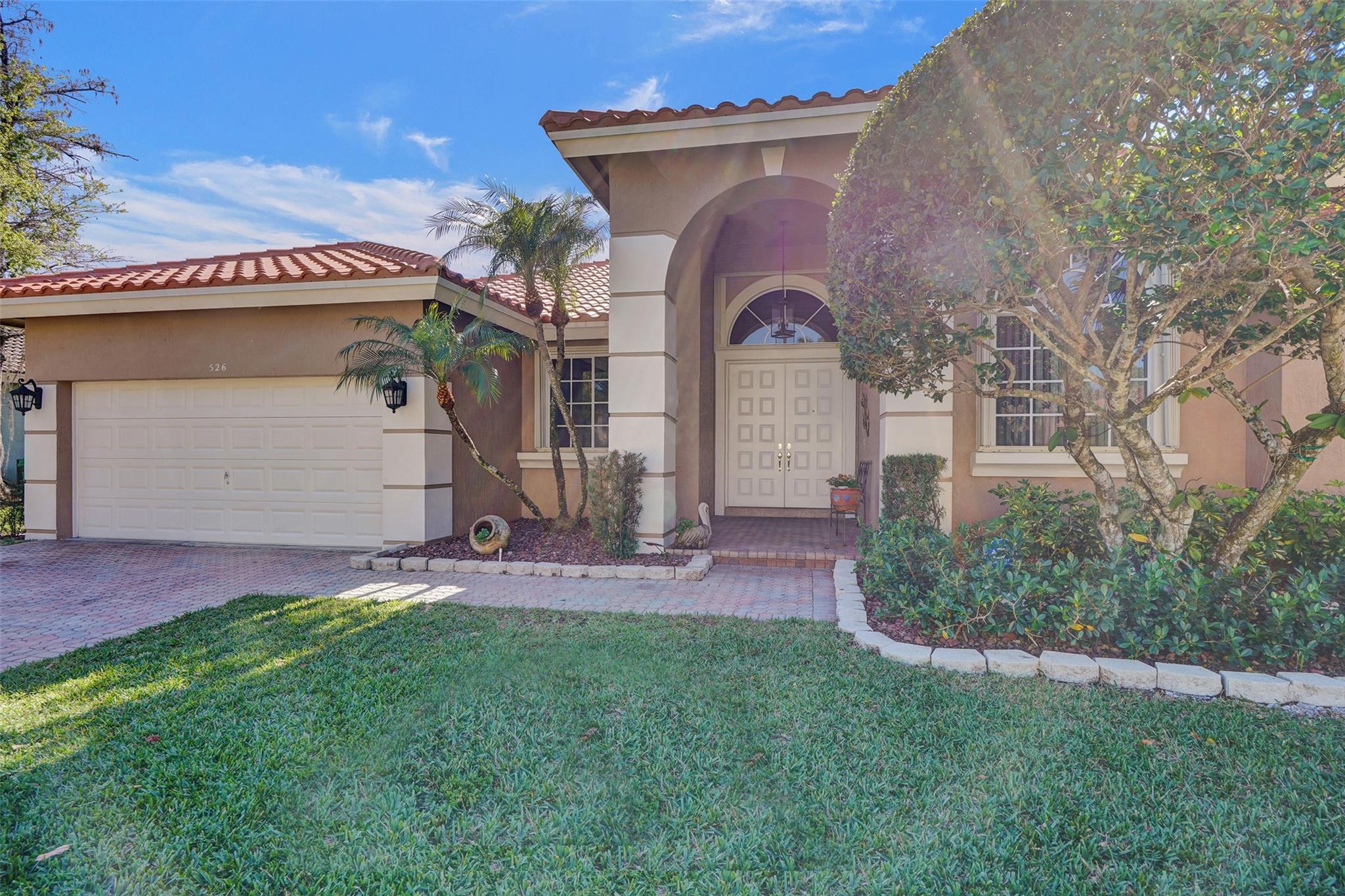 Live in the popular gated Mariners Cove in SW Coral Springs! Roof 2022. Fenced yard is lushly landscaped! Dual Generator (Propane/Gas) & Accordion shutters! Salt Water Open Pool surrounded by yard & rock garden! Foyer entry with a den off of the bedroom suites with new cabana bath! Owners rm on the opposite side of the home features wood floors, pool access and a separate roman tub! Built-ins in the closets! Soft color wood cabinets with double wide pantry & fabulous granite counters, tiled backsplash in the kitchen with an expansive island workspace! So much natural light in this home! Won't last at this price!