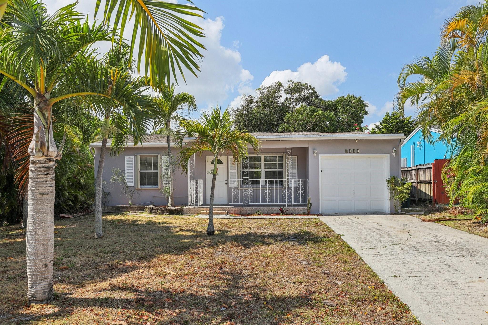 This 2-bedroom, 2-bath single-family home offers 1,096 sq ft of living space on an expansive 8,750 sq ft lot. Featuring tile flooring throughout, a spacious kitchen, and a generous primary suite, this residence provides a comfortable living environment. The fully fenced backyard offers ample space for outdoor activities or potential enhancements. Located in the Sunset Ridge neighborhood, you're just minutes from downtown Lake Worth Beach's vibrant shops, dining, and cultural attractions. The Atlantic coastline is approximately 2 miles away, providing easy access to beachside relaxation. Commuters will appreciate the quick access to I-95, ensuring convenient travel throughout Palm Beach County.