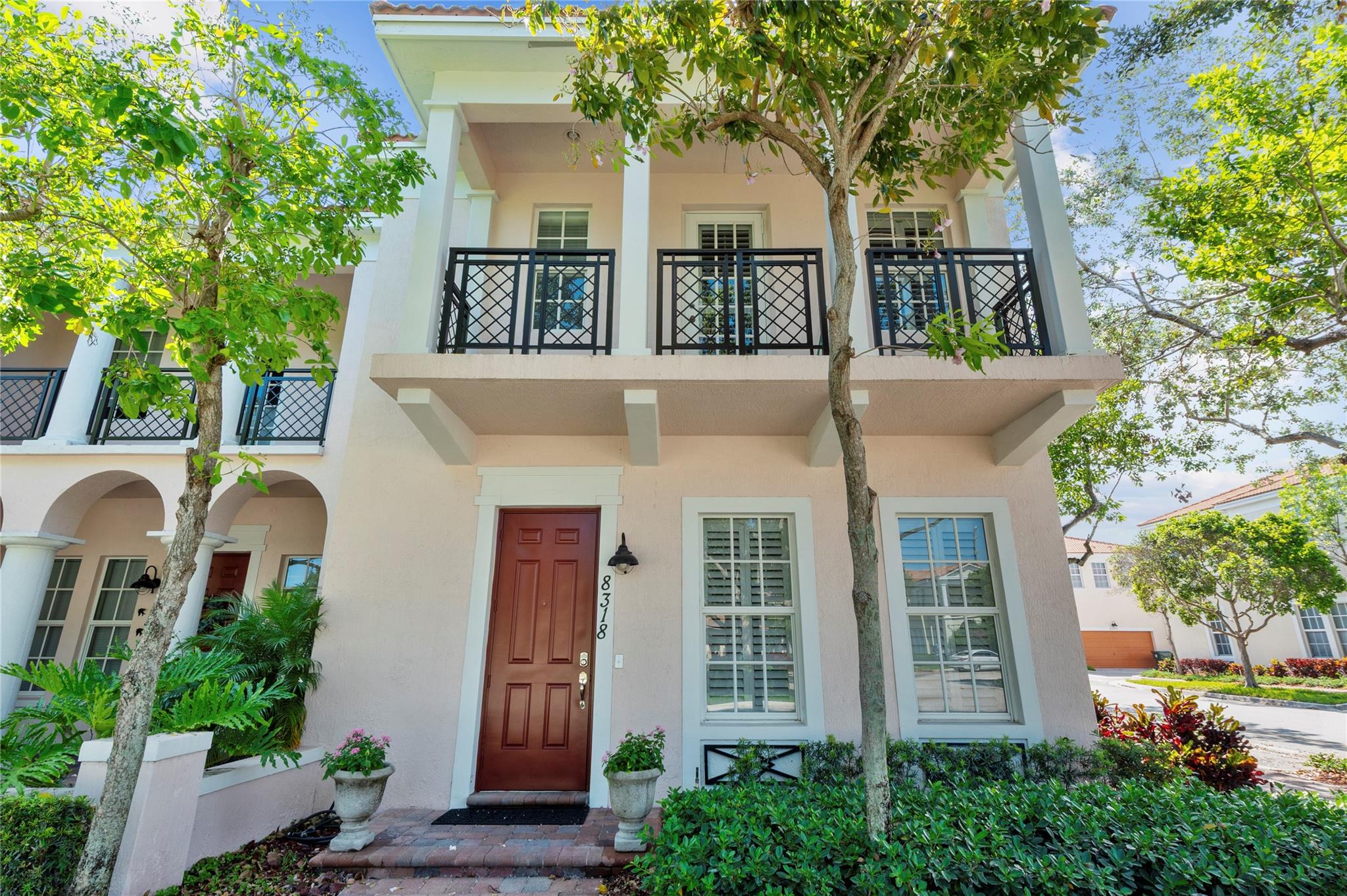 This beautiful townhome is located in Boca directly on the Boca/Delray county line.  This home is very spacious and has all impact windows and doors. Large tile floors on the main level with gorgeous laminate wood floors on the stairs and throughout the upstairs hallways and bedrooms. The kitchen has cherry cabinets and all stainless steel appliances.  The master suite feature dual walk in his and her closets.  The porch is ideal for a barbeque or simply just to soak up the sun.  This charming neighborhood features a large community pool, a well outfitted gym, a kids play ground, a dog park and walking paths throughout. Garage door and A/C are just three years old. Rules and Regulations and application attached to the listing