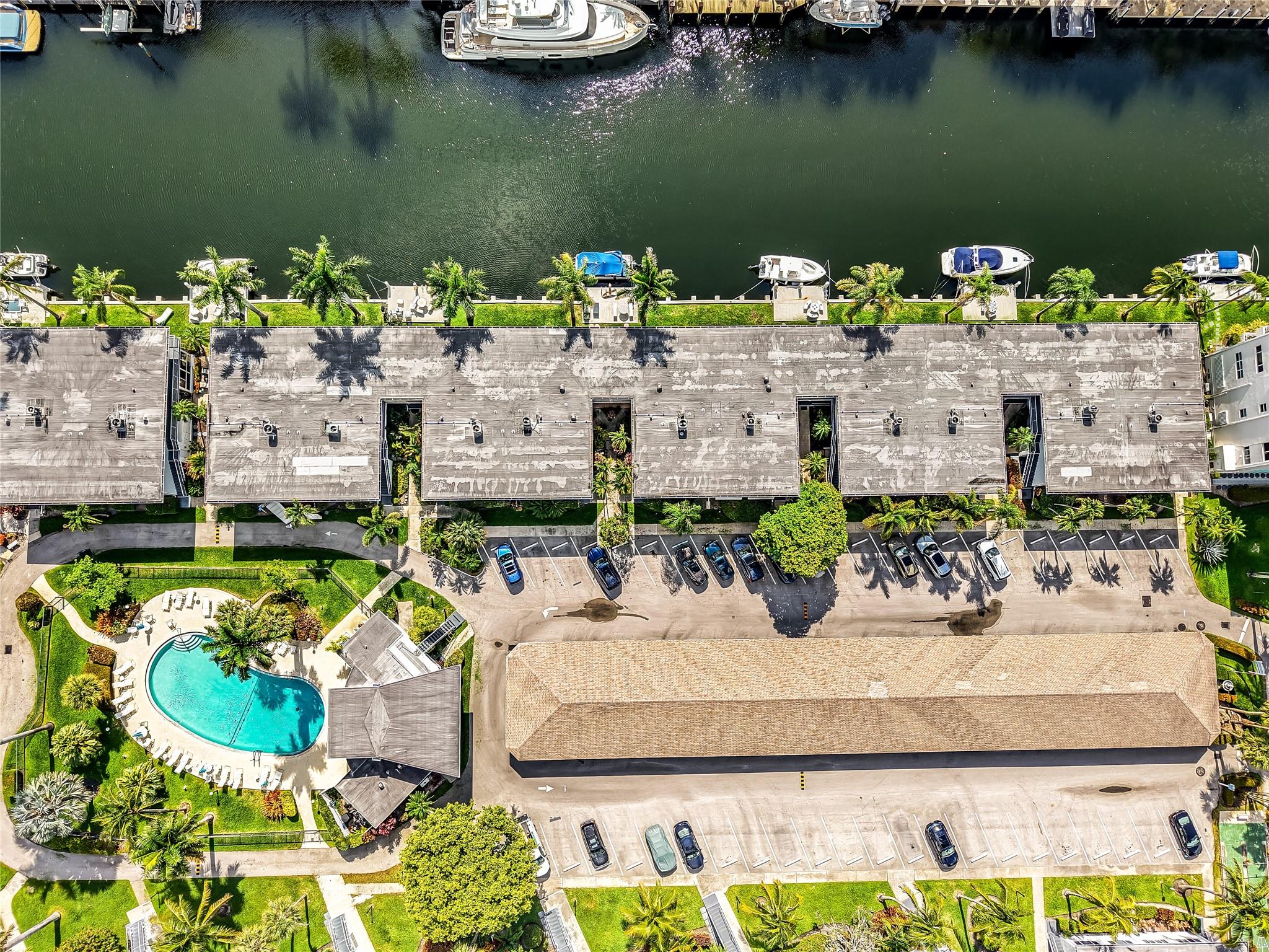 Live the Las Olas waterfront lifestyle in this beautifully renovated, fully furnished 2/2 with deep water ocean access—no fixed bridges. Dock your 33’ boat just steps from your first-floor unit and cruise to the Sandbar in 15 mins, Port Everglades in 20. Enjoy stunning, floor-to-ceiling water views from your sunroom and living room, facing a canal lined with multimillion-dollar homes. Features include impact windows, tile floors, newer AC & electrical panel, in-unit laundry room, one assigned covered parking spot, and ample guest parking. Strong reserves, financing available. Land share also available for purchase. Cheapest way to live on the Isles!