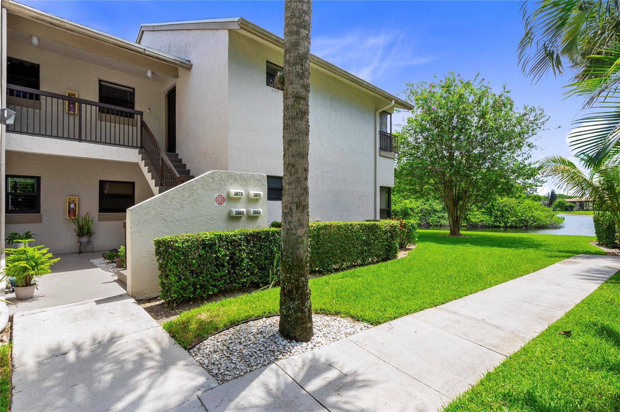 Updated, beautifully maint’d 3BR/2BA ground-flr condo in lakefront bldg—super clean, light, bright & truly move-in ready! You’ll love the upgraded kit w/ quartz, marble backsplash, newer SS appls, crown molding, 16x16 tile thru-out, impact wndws & glass drs, plantation shutters, popcorn removed & prof. custom WIC in primary. BR2 works as office or BR; wall bed/shelving in BR3 conveys. In-unit W/D. Glass-enclosed patio adds flex living space. Steps to peaceful lake views! Resort-style amenities: 2 pools (Olympic-size w/ lifeguard), gym, sauna, hot tub, theater, movies, shows, tennis, pickleball, racquetball, bball, vball, art/ceramics studio, woodshop, BBQ, jogging trl & more! All-ages, finance-friendly, reserves, water & cable incl., 2 pets OK ( Updated, beautifully maint’d 3BR/2BA ground-flr condo in lakefront bldg—super clean, light, bright & truly move-in ready! You’ll love the upgraded kit w/ quartz, marble backsplash, newer SS appls, crown molding, 16x16 tile thru-out, hurricane impact wndws & glass doors, hurricane shutters on the windows outside of the unit, plantation shutters, no popcorn ceilings & prof. custom WIC in primary. BR2 works as office or BR; wall bed/shelving in BR3 conveys. In-unit HE W/D. Glass-enclosed patio adds flex living space. Steps from peaceful lake views! Resort-style amenities: 2 pools (Olympic w/ lifeguards), gym, sauna, hot tub, theater w/ movies, shows, tennis, pickleball, racquetball, bball, vball, art/ceramics studio, woodshop, BBQ, jogging trail & more! All-ages, finance-friendly comm., reserves, 2 pets OK (
