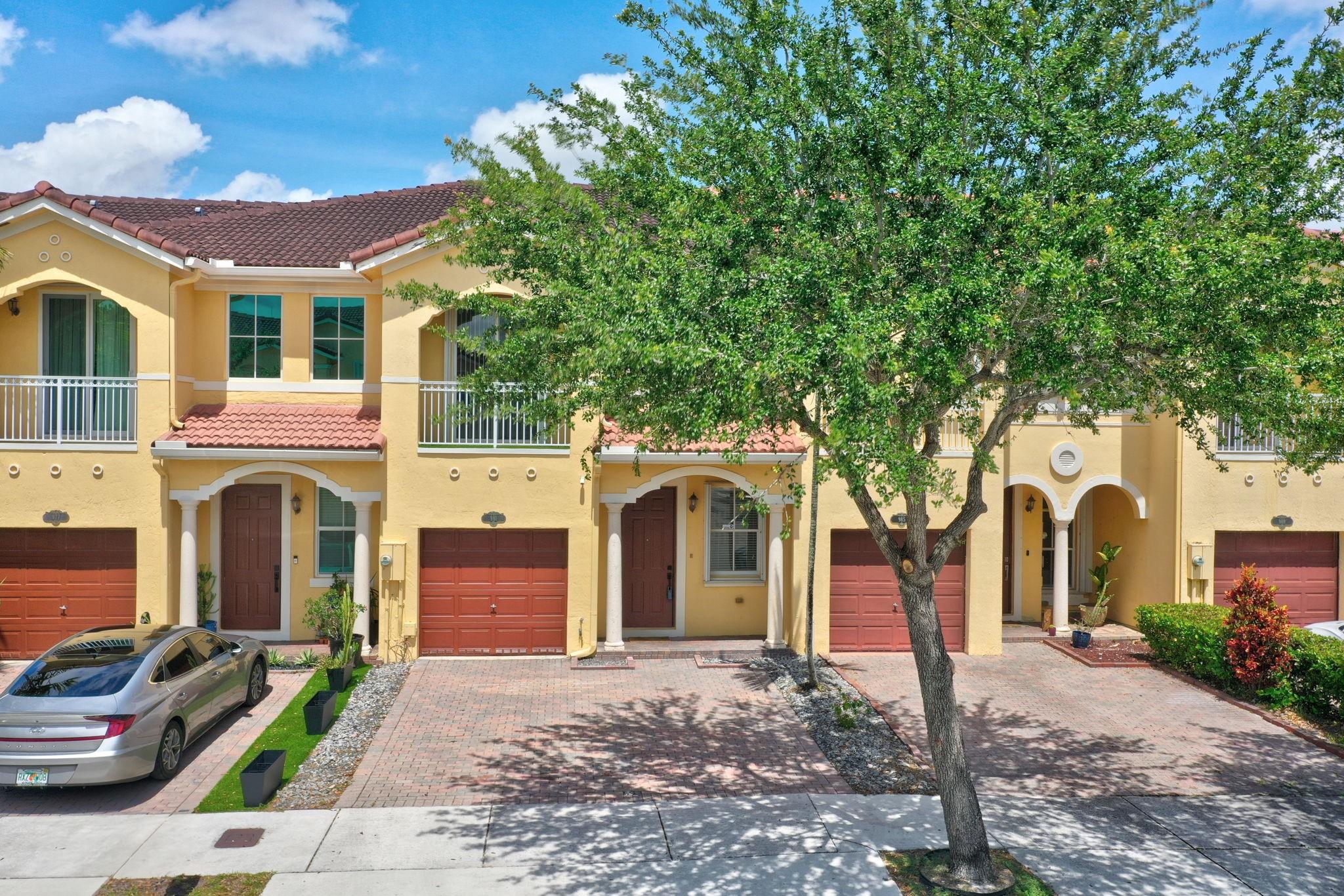 Step into style and comfort in this stunning 2-story 3 Bed 3 Bath 1 car garage townhouse. Built in 2004 and recently remodeled top to bottom, this home offers modern living with timeless appeal • You'll love the spacious layout featuring 1 Bed and 1 Bath downstairs, 24" x 24" ceramic tile throughout the first floor and warm wood floors upstairs. The kitchen is a showstopper—completely redesigned with new appliances, sleek top-of-the-line cabinetry, perfect for everyday cooking or entertaining. All bathrooms have been beautifully updated •The dreamy oversized master closet is the kind of space you didn’t know you needed (until now!) •Accordion shutters on all openings provide peace of mind, while the private backyard with artificial turf means zero lawn maintenance and year-round greenery.