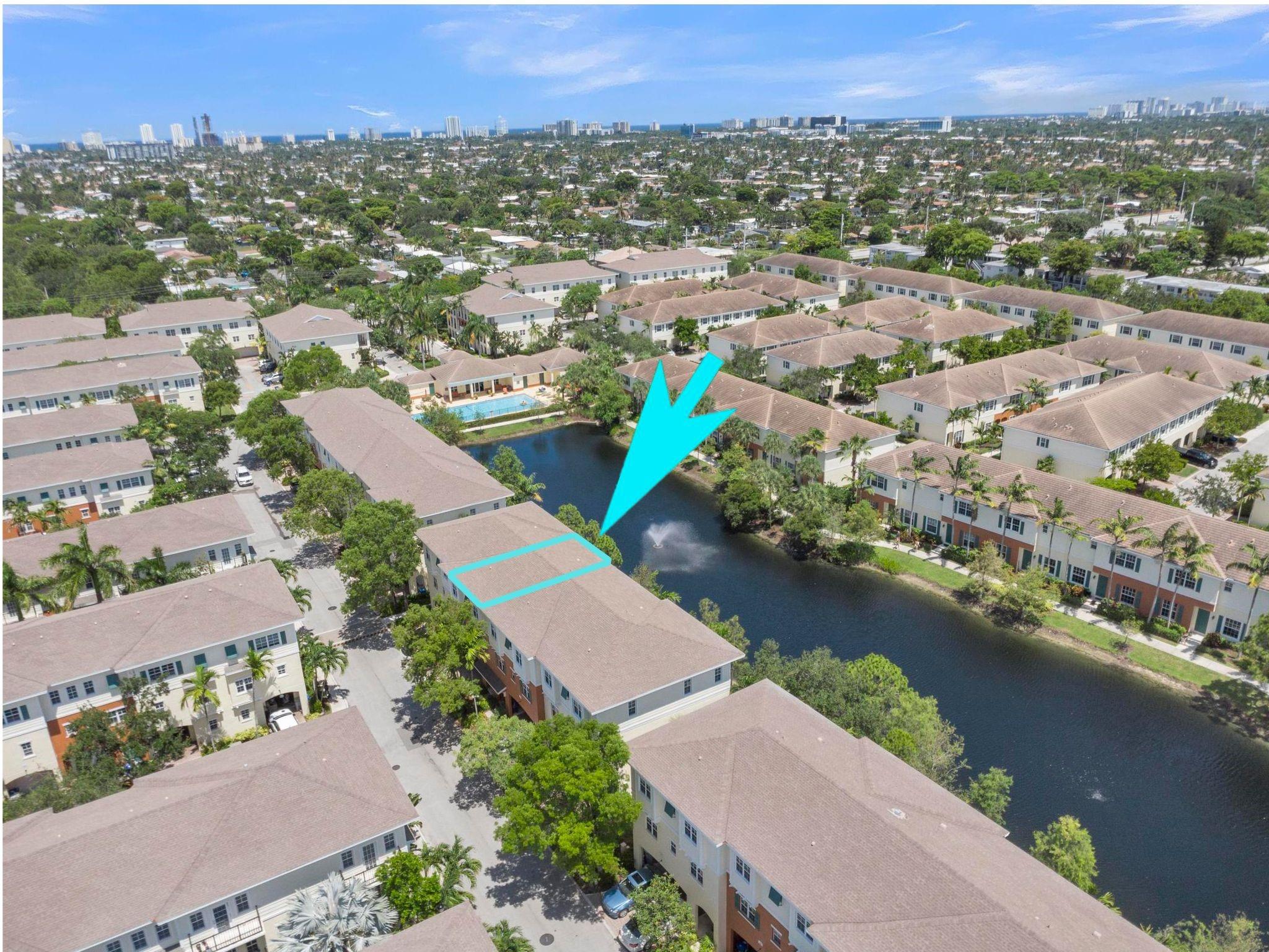 Spacious Lakefront Townhome in Orchid Grove! Welcome to the largest model in Orchid Grove, offering 2,733 sq/ft, a 2-car garage, and stunning lake views. Just steps from the heated pool and fitness center, this 4-bedroom, 2.2 bath home features luxury vinyl plank flooring throughout. The first floor includes a versatile office/4th bedroom with custom built Murphy bed and half bath. The 2nd level boasts a large open-plan kitchen with white cabinets, granite counters, stainless appliances, bar-height island, dining area, spacious living room, lakeview balcony, and half bath. Upstairs, two guest bedrooms share a full bath, while the spacious master suite includes dual walk-in closets and an updated ensuite with marble tile shower, tub, and double vanities. A rare find in a great community!