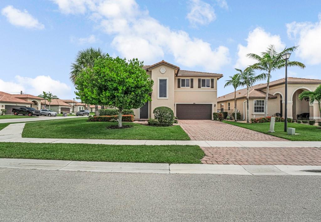 Move-in ready, gorgeous updaded corner single family home. Rare opportunity in Vista Lago. Discover a tastefully home with volume ceilings and open floor plan. The fresh interior and exterior paint add a modern touch. The owners have made sustantial improvements. The split floor plan featue 2,304 A/C sqft, 3 bedrooms, 2.5 bathrooms and a large loft used for office or playroom. The home has impact windows, crown molding, title floor at the first floor. The entire second floor and stairs have recently been updated with beautiful wood floors. The kitchen has upgraded stainless steel appliances, granite countertops.  New installing a fully fenced yard. The spacious backyard is ready for a pool and perfect for unwinding, making this home inviting for families and entertainers. Ready to move in!