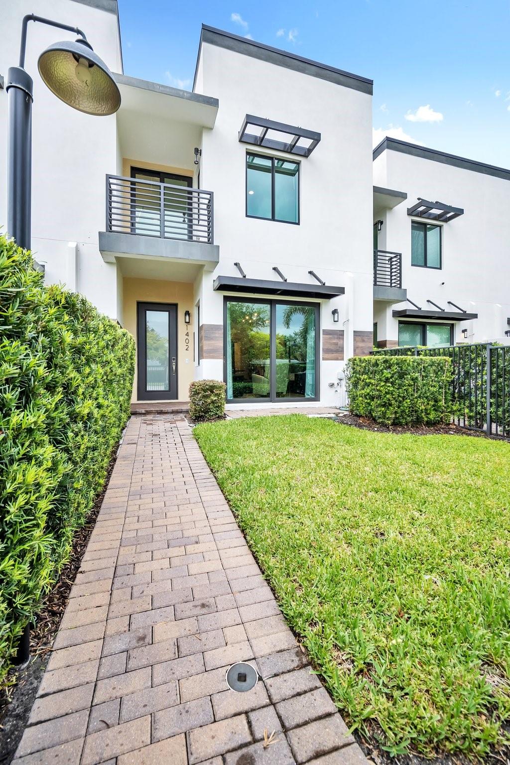 Spacious Luxury Townhome in the Croissant neighborhood. Complete with upscale home theater with Atmos surround sound. This contemporary open-floor townhome boasts 3 bedrooms, 3.5 baths plus loft over 2099 sq ft of living area with 2605 total sq ft. This boutique community comprises 7 units, each with a 2 car garage. Kitchen is complete with island, breakfast nook, Stainless steel appliances, quartz countertop with decorative glass tile backsplash.  Luxurious spa-like master bath, oversized shower with a frameless clear glass enclosure, Master bedroom has an expansive walk-in closet and private balcony, custom made blinds, impact windows and doors. Conveniently located, minutes away from the Theater, Las Olas,  the Hospital, beaches, all major arteries of transportation, airport & seaport. Home theater description 

Experience cinematic luxury in your own home with a premium 7.1.4 Dolby Atmos-ready theater system. Featuring a stunning 120” screen paired with a 4K Hisense short-throw projector for ultra-sharp visuals, and powered by a Denon AV receiver for immersive, theater-quality sound. Professionally installed in-ceiling speakers complete the surround experience—ready for movies, gaming, or entertaining in style.