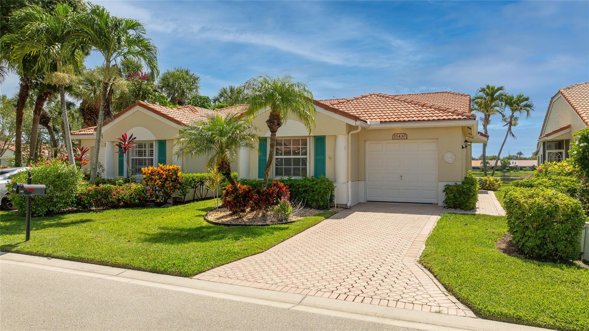 Enjoy Spectacular long lake views from this spacious light & bright corner villa featuring 3 bedrooms & 2 bathrooms. The home boasts an updated kitchen, volume ceilings, open-concept floor plan, screened-patio, private garage & newer A/C, Water Heater & Accordion Storm Shutters for added peace of mind.

Ideally located just steps from the clubhouse so you can take full advantage of the resort-style amenities  including pickleball, tennis, bocce, a massive  pool & state-of-the-art fitness center. The clubhouse  boasts a stunning Lobby, ballroom, hobby & media rooms, billiards, & more. A Host of Fun Clubs & activities await. On-site management, beautiful tree-lined streets, & close proximity to shopping, dining & everything Delray Beach has to offer! WELCOME TO THE LIFESTYLE YOU DESERVE !