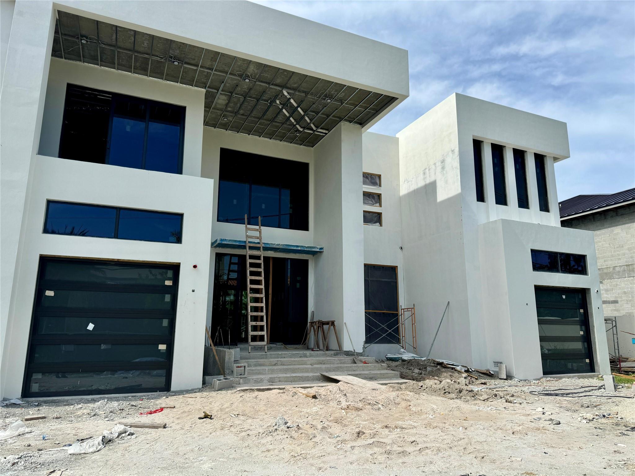 This striking new-construction architect-designed Modern-style waterfront residence near Las Olas is introduced by the grand clear-story entry, with a striking metal-and-glass stairway and a ‘wow-factor’ clear acrylic-sided elevator. Huge windows and doors throughout offer amazing water views, and with 100-feet +/- on the water and a dock, boaters are granted easy access to the Atlantic.

COMPLETION EXPECTED in 6-7 months.  Interior drywall being installed now.  Custom cabinets, Control 4 system for Electric and Audio Visual.  Amazing custom finishes and priced to sell.  Buy NOW and pick your colors.

Please see the Supplement Remarks section for full description.  Plan subject to change.  Please verify final plans and specs. An elegant cosmopolitan ambience is achieved in this spectacular Modern-style seven-bedroom masterpiece, with 8,999 +/- total square feet. Astutely designed by Michael Sher of Symcon Development / Logic Builders Inc, this new-construction residence will be ready for occupancy in 2024. Creating an immediate impactful allure, the grand clear-story entry, which incorporates a striking metal-and-glass stairway and a ‘wow-factor’ clear-acrylic-sided commercial elevator, flows into the open-floor-plan main living areas. These include a great room, dining area, and morning room, all organized around the gourmet kitchen, a convenient layout for easy service when entertaining. Beautifully conceived details throughout include huge impact-glass doors and windows offering spectacular water views, high ceiling heights, and large-format porcelain tile flooring. The center-island kitchen, sure to satisfy the chef, is finished with sleek European-style cabinetry, white-quartz counters and backsplash and stainless-steel professional-grade appliances. A second island/breakfast bar is especially useful, as it can accommodate pull-up seating for five for informal dining. All about water views, the main living areas and the VIP guest bedroom suite access the pool patio area. Additional rooms downstairs include a library/den, cabana bath, laundry, staff bedroom suite and a glass-enclosed temperature-controlled wine room. Upstairs the primary suite, three guest suites, and media/ guest bedroom are arranged around a family-entertainment salon, which opens to a water-view balcony. The primary bedroom and a guest suite also open to pool-view balcony and a guest suite accesses a garden-view balcony. The spacious primary suite, which presides over half of the second-floor, comprises two huge walk-in closets, an expansive spa-inspired bathroom and an exercise studio. Completing this luxe residence are two attached garages, and high-end amenities include recessed LED lighting, four-zone HVAC systems, pre-wiring for speakers, salt-water and chlorination pool systems, and a concrete roof.



DISCLAIMER: Information published or otherwise provided by the listing company and its representatives including but not limited to prices, measurements, square footages, lot sizes, calculations, statistics, and videos are deemed reliable but are not guaranteed and are subject to errors, omissions or changes without notice. All such information should be independently verified by any prospective purchaser or seller. Parties should perform their own due diligence to verify such information prior to a sale or listing. Listing company expressly disclaims any warranty or representation regarding such information. Prices published are either list price, sold price, and/or last asking price. The listing company participates in the Multiple Listing Service and IDX. The properties published as listed and sold are not necessarily exclusive to listing company and may be listed or have sold with other members of the Multiple Listing Service. Transactions where listing company represented both buyers and sellers are calculated as two sales. The listing company’s marketplace is all of the following: Fort Lauderdale, Deerfield Beach, Hillsboro Beach, Hillsboro Shores, East Pompano Beach, Lighthouse Point, Sea Ranch Lakes Vero Beach, Town of Orchid, Indian River Shores, Town of Palm Beach, West Palm Beach, Manalapan Beach, Point Manalapan, Hypoluxo Island, Ocean Ridge, Gulf Stream, Delray Beach, Highland Beach, and Boca Raton. Cooperating brokers are advised that in the event of a Buyer default, no financial compensation will be paid to a cooperating Broker on the Deposits retained by the Seller. No financial compensation will be paid to any cooperating broker until title passes or upon actual commencement of a lease. Some affiliations may not be applicable to certain geographic areas. If your property is currently listed with another broker, please disregard any solicitation for services. Copyright 2022 by the listing company. All Rights Reserved.