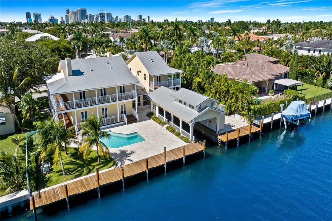 JUST NEWLY PRICED TO SELL! A very rare opportunity to own this truly unique Key West style waterfront residence that was once the estate of marine industry legend Ole Evinrude. Boasting the only true "boathouse" in East Fort Lauderdale with 115'+ feet of waterfront with a covered boat slip berth of 40'x12' & added bonus of guest house / captain quarters upstairs. This superbly designed & custom-built home exudes modern warmth, charm & classic lines that will appeal to buyers that does not want the ever-present sterile white box & glass homes.  This spacious residence is the perfect yachtsman's trophy home or could be a great opportunity for the savvy investor looking to have a high-end vacation rental situation. All impact windows & doors, whole house generator & grand covered porches.
