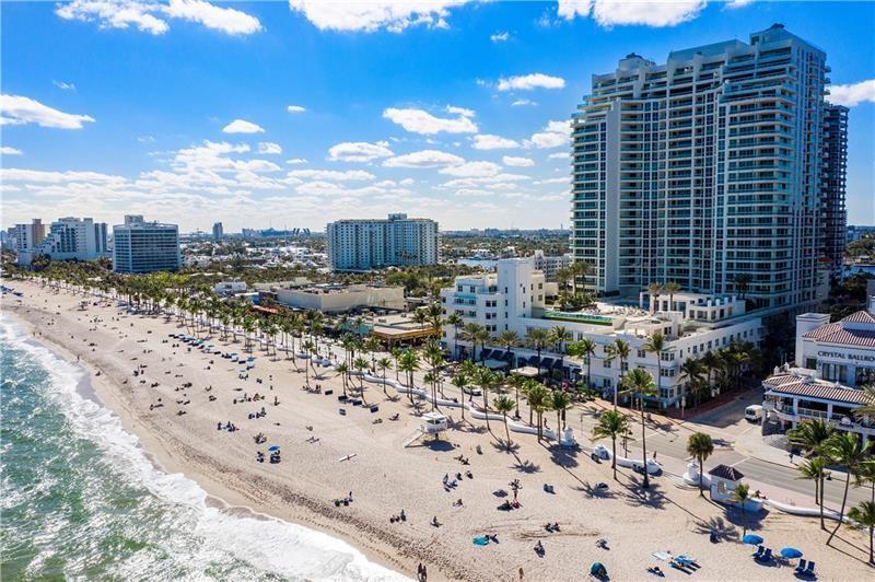 Experience unparalleled luxury in this rare, custom-designed 27th-floor Penthouse spanning from East to West! Over 1700 sq ft of expansive terrace space frames uninterrupted Direct Ocean views, stunning sunrises & dramatic sunsets. Gaze at the city's impressive skyline & Intracoastal from the Western wing. As one of only two units with this floorplan, exclusivity is assured! Private elevator entry & an open concept design showcasing a state-of-the-art custom kitchen. A versatile office/den easily transforms into a 4th bedroom. Floor-to-ceiling high impact glass magnifies the allure. This turnkey 3-bed, 3.5-bath Penthouse, beautifully remodeled, boasts updated hardware, doors, flooring, lighting, with cutting-edge audio & touchscreen options. Own a piece of the sky in this unique sanctuary!