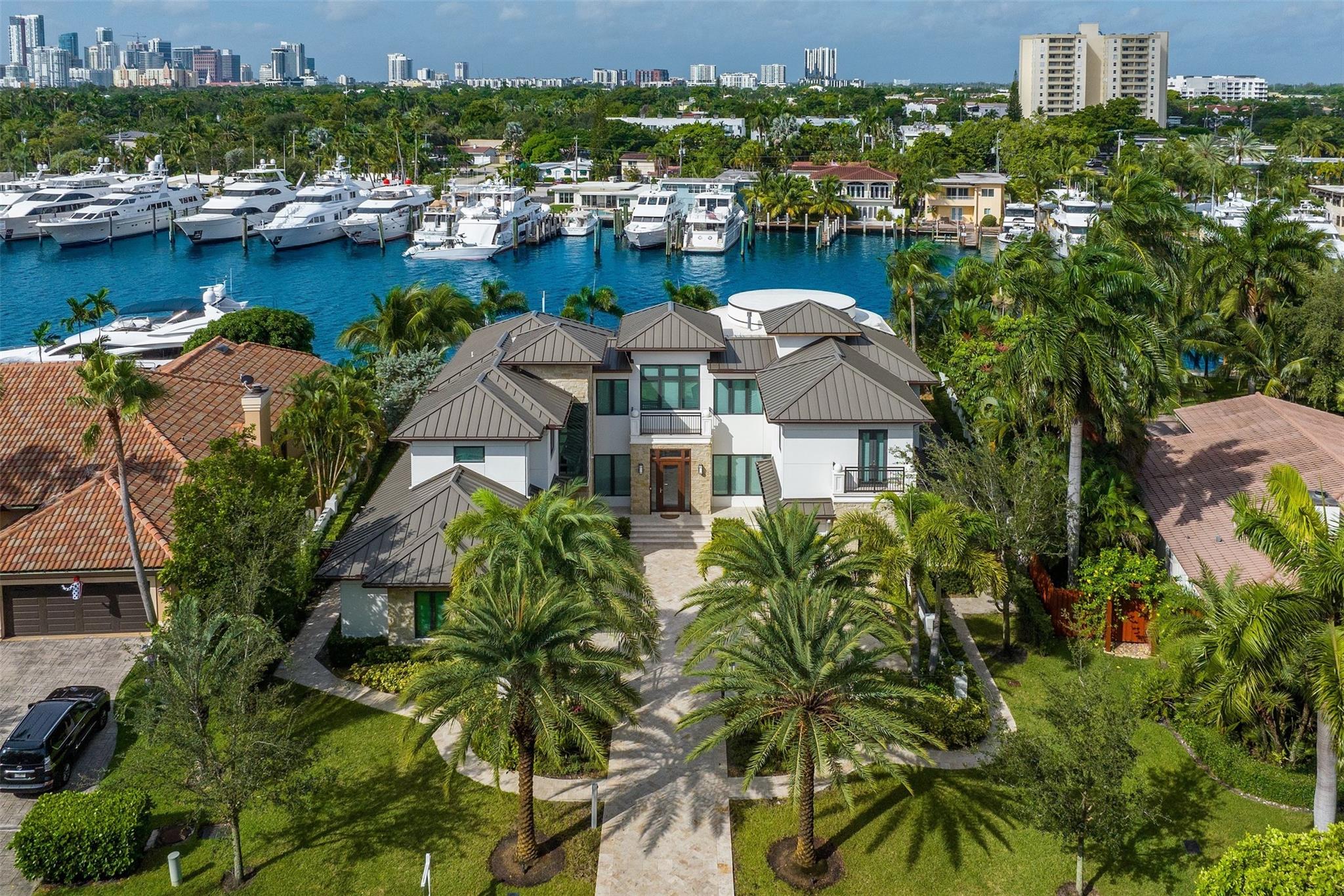 Nestled in the prestigious Sunrise Intracoastal enclave, this stunning estate emerges as a paragon of luxury waterfront living.  This 5-bed, 5.5-bath masterpiece spans 6,994 SF, offering unmatched elegance. A generous 123' of prime WF, a sleek contemporary design, private elevator & an inviting open entertaining area, seamlessly connecting to a chef's kitchen & dining room. A VIP suite & private home cinema complete the ground level. The grand primary suite offers an intimate retreat, complete with lavish dual bathrooms, walk-in closets and oversized terrace. Outside, the serene waterfront vista is complemented by a sophisticated entertainment area, where luxury meets nature's beauty. Experience the pinnacle of South Florida luxury living! Beach, shopping and dining just minutes away!