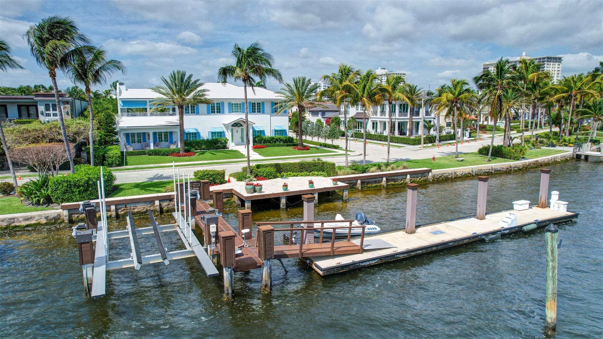 Newly built custom intracoastal Estate offers a daily boat parade with wide open intracoastal views from many rooms. Superbly located in highly desirable, security patrolled Idlewyld, close to beaches & Las Olas. Barely occupied, shows impeccably & as-new! Sophisticated island inspiration, high quality construction, millwork & natural finishes, hardwood floors & unique marbles. Lutron technology. Ultimate Chef's kitchen, professional grade appliances. 1st level: media, living & dining areas, 6th bed suite/home office option. Upstairs 4 bedrooms + ultra-luxury Primary Suite, dual closets/spa baths. The large covered outdoor terrace off primary suite captures constant views & breezes. Private resort style pool/spa, cabana. 100ft frontage/30,000lb lift/floating multi boat dock in No Wake Zone - Additional lot is NOT INCLUDED.
- All outdoor patios, walk ways and pool surround are Shell Reef brushed limestone. Handcrafted glass mosaic tiles in the pool and spa that has a wall fountain feature.
- Saltwater pool with stepping stone and beach ledge water features.  Pool side gas fire bowl feature, retractable electronic awning and separate spa.  Dedicated cabana bathroom.
- Kitchen countertops are Taj Mahal honed & leathered quartzite.  Backsplashes Ann Saks.  Professional grade appliances includes La Cornue gas range, Sub-zero fridge and freezer plus two dishwashers.  Large center island perfect for casual dining.
- Downstairs en-suite potential bedroom, office or media area.
- Large two car garage has custom cabinetry and storage.
- 2nd level Primary Suite is the perfect retreat.  Private access to the large covered terrace which is perfect for capturing the intracoastal views in privacy.  Enjoy the vaulted ceilings and island ambiance!  There is also a private exterior staircase offering access to the pool.
- Primary Suite includes two separate spa style bathrooms finished with statuario marble, custom cabinetry and tiles. Two large dressing rooms and morning bar.
- Two of the secondary bedroom suites have access to a private stairway down to the pool and lawned additional lot.
- The intracoastal waterway bedroom suite has an incredible spa style bath with soaking tub and separate shower.
- The laundry and utility room is on the second level.
- Air conditioners include: #1/5 ton, #2/3 ton, #3/2 ton, #4/3 ton and 2 mini splits in the family room plus 1 mini split in the garage.
- Idlewyld Security has two elements, the Idlewyld Improvement Association maintains the gate and center island.  There is also private security patrol overnight.
- Low tide depth at the dock is approximately 7 ft and there are 5 ft boater's set backs & 30,000 lb boat left.  Multi yacht dockage potential to put a larger yacht on the outside dock, tender on the lift and additional smaller boat or water toys on the inside of the floating dock.  All privately gated.
_ New construction by top builder, Jim La Vallee Construction, Fort Lauderdale.  The custom detailing and quality of this residence must be seen to be appreciated.