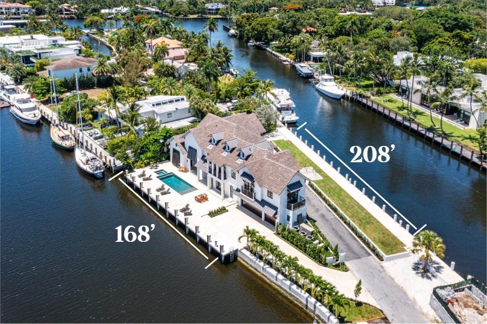 Introducing an architectural marvel in the coveted Las Olas Isles! Newly completed in 2022, this waterfront residence spans over 2 docks w/ 376' of WF offering a contemporary & convenient lifestyle. Elevating your living experience, home is equipped with a cutting edge Lutron Control 4 Smart Home system & top tier security. The thoughtfully designed layout seamlessly blends dining & living areas, a versatile bonus space, 2 primary suites, office, & more! The primary suite on the first floor is a retreat in itself, with multiple walk-in closets & a spa like bathroom. The chef's kitchen is adorned with SubZero & Wolf appliances. Home also includes an air conditioned garage, 3 laundry rooms, & a 48kw generator. Don't miss the opportunity to make this exceptional waterfront estate your own!