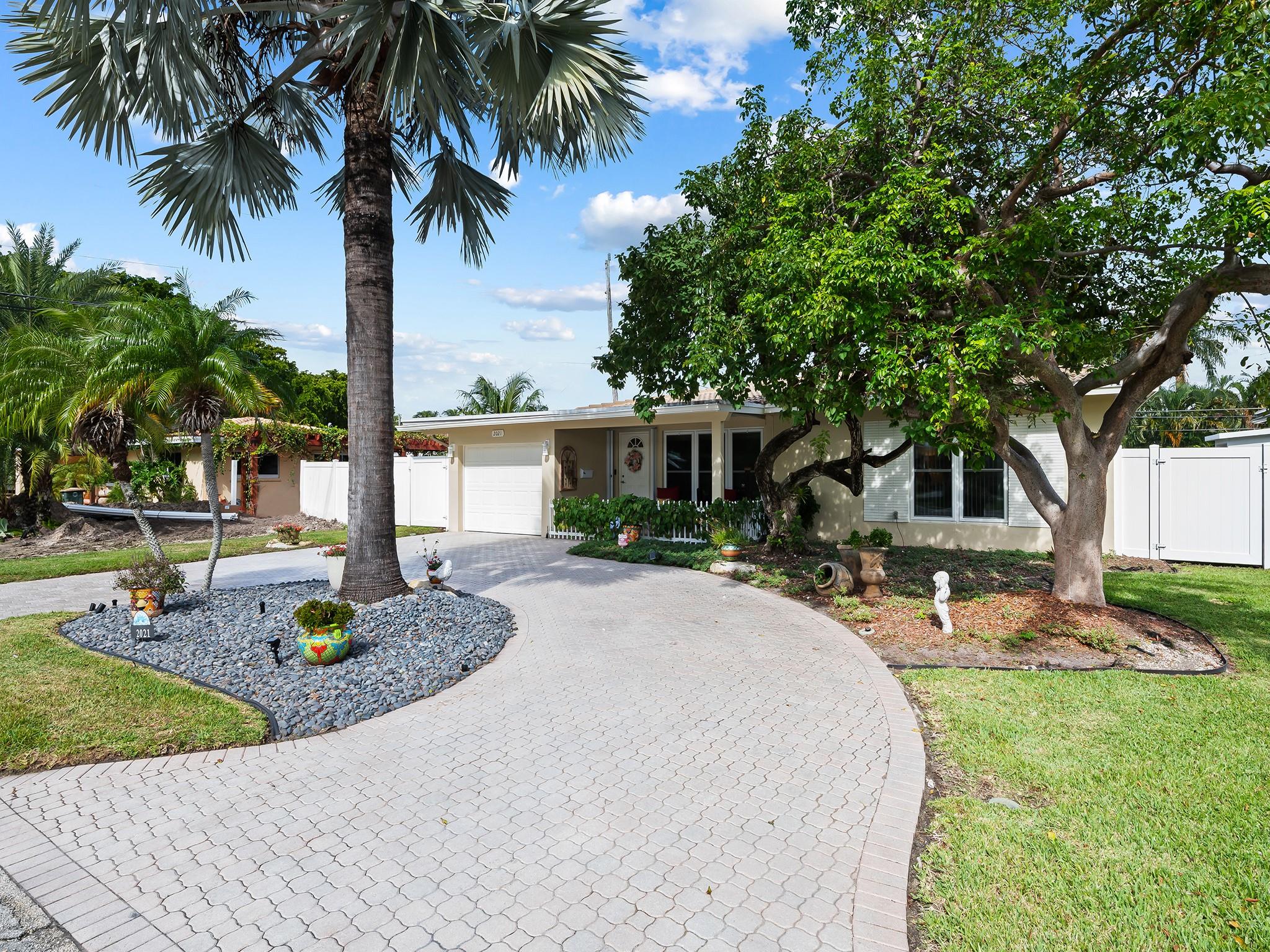 Come and see this spacious 3 bedroom 2 bath home with large yard on a quite street in southern Lighthouse Point. This home shows true pride in ownership with many updates including new roof in 2020, impact windows, new appliances in 2021, updated electrical service and panel, brand new water heater and newer PVC fence for the large yard. The home has ample living areas and an oversized den at the at the back of the house that could easily be converted into a 4th bedroom. Enjoy the spectacular South Florida evenings in the screened in porch over looking the huge back yard with plenty of room to add a pool with space to spare. Ideal location and home for snowbirds or full time residence. This home is will not disappoint.