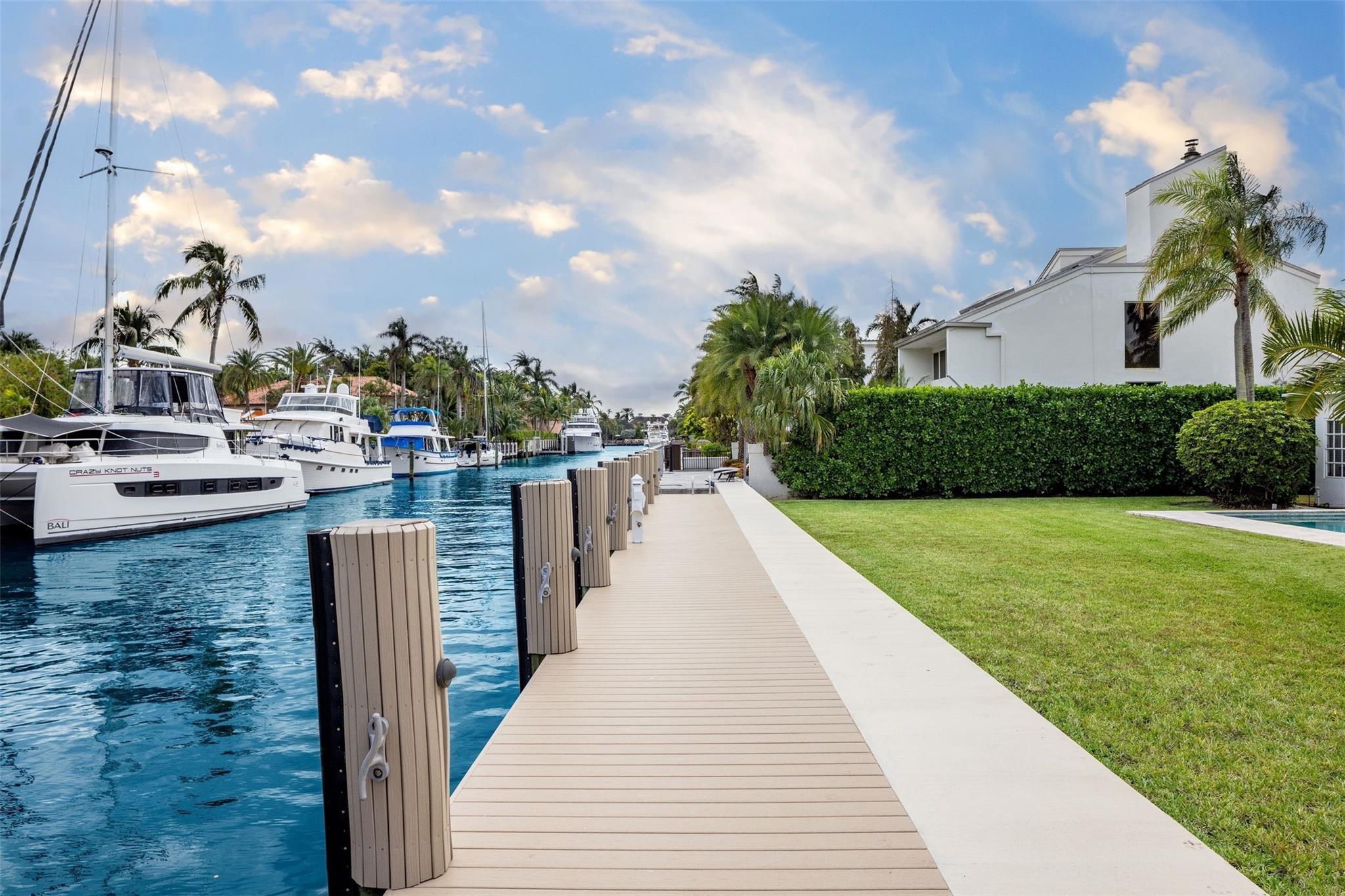 Don't miss this incredible opportunity in the prestigious & gated Riviera Isles! This property offers an exceptional waterfront experience with a fully equipped dock, on an impressive 100' of WF. Ideal for boating enthusiasts, located just off the Intracoastal & only minutes to the ocean, this 3-BD/3-BA home features a well-thought-out split floor plan. The expansive backyard features a covered terrace, a refreshing pool and a highly sought-after rear eastern exposure allowing for tranquil breezes year round. This home offers the added advantage of being within walking distance to the beach, exquisite dining establishments, upscale shops, and renowned art galleries and it's proximity to the airport. Don't let this opportunity slip away! Income Investment opportunity!