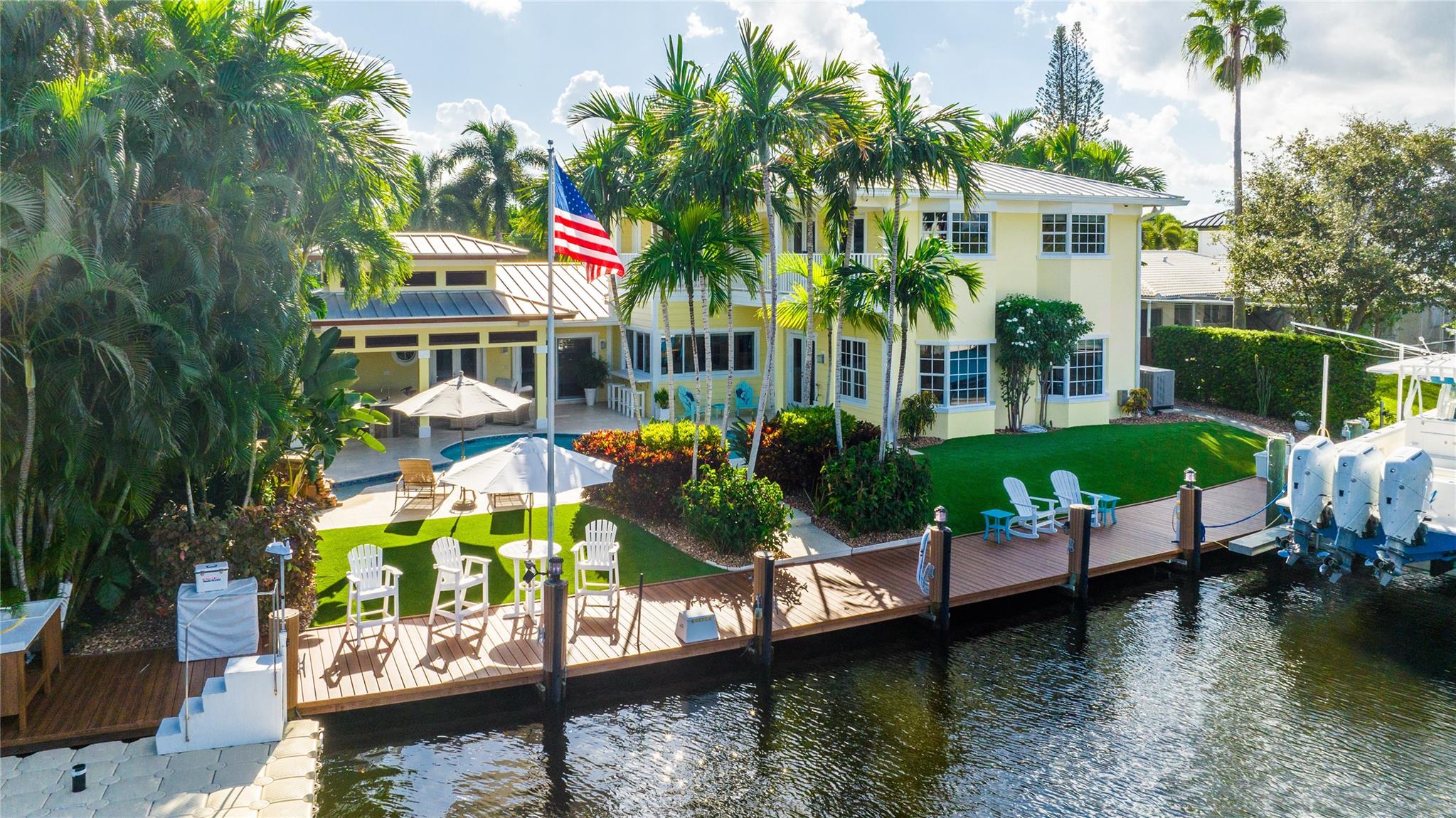 Exceptional waterfront oasis nestled in a cove in the Landings! This tropical paradise boasts 104 ft of water with 94 ft of dockage and 24K lbs. boat lift looking across 170 ft of water giving you a feeling of privacy that is not often found on the water. Inside you will find a remodeled home with a split bed floor plan, 3beds/2baths downstairs. Upstairs you will be able to enjoy another family room plus 2beds/2baths. Gorgeous Landscaping surrounds the property with zoysia grass in front and artificial turf out back.  The large lanai makes a perfect hang out and is equipped with a grill, flat top, ice maker and refrigerator. Natural gas runs the 45KW whole house generator, Wolf stove, oven, grills and tank-less water heaters.