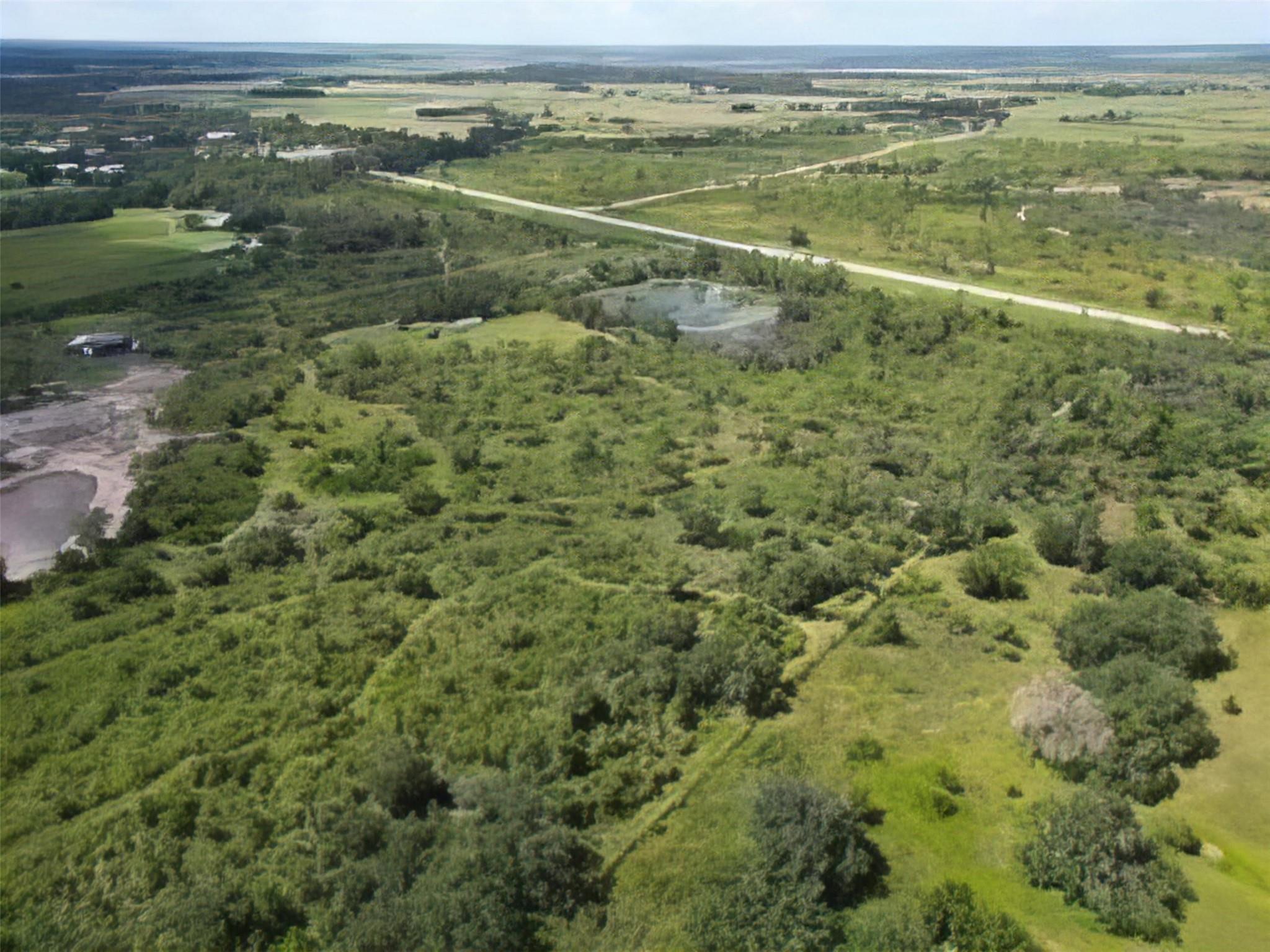 This 21-acre property in Okeechobee County along Highway 98 is a stunning natural haven. It boasts saw palmettos and towering pines, offering a tranquil retreat for nature lovers. A serene flag pond adds to the property's charm, creating a picturesque landscape perfect for various outdoor pursuits or development opportunities. Embrace Florida's natural beauty in this captivating setting.