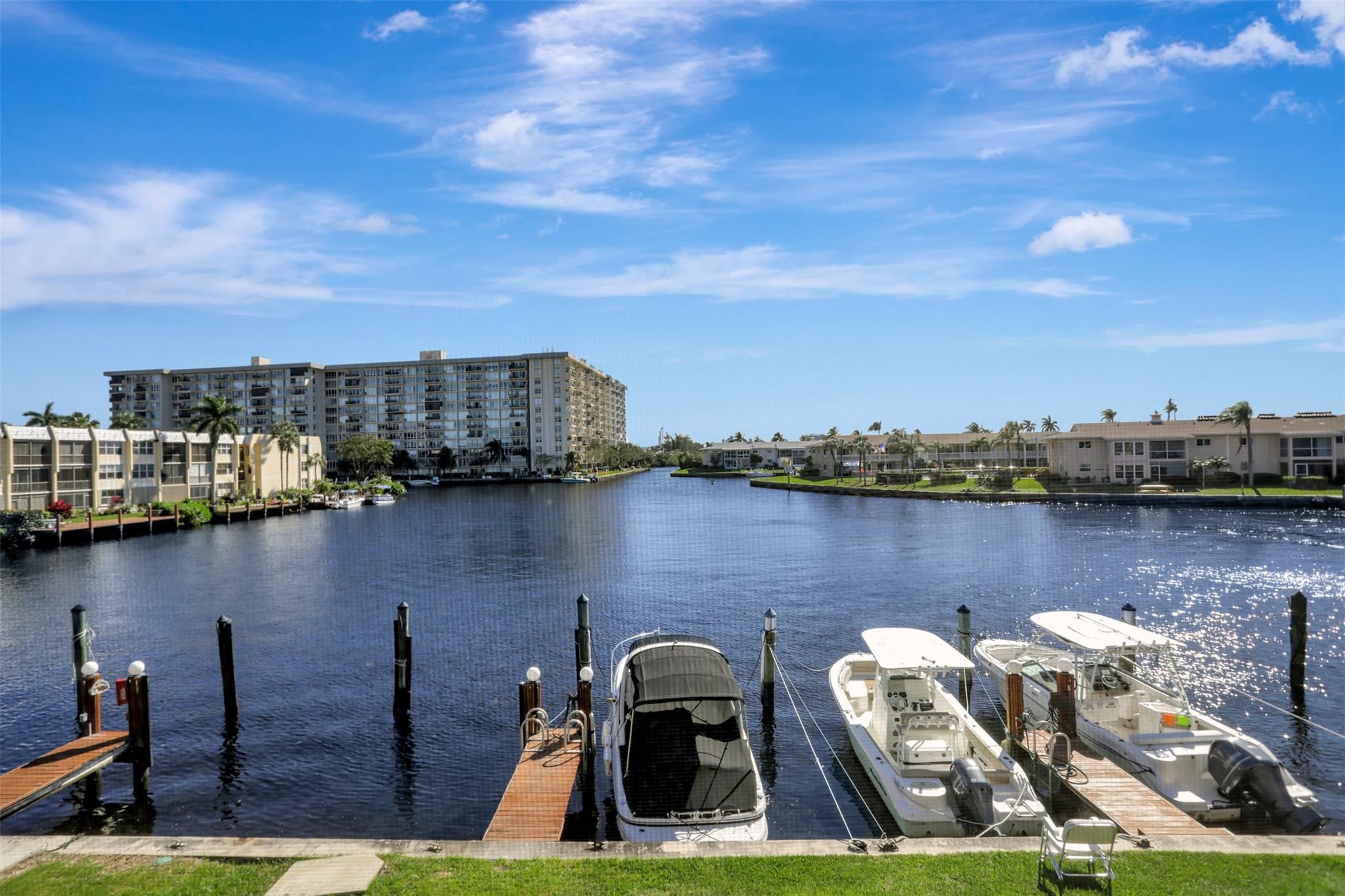 YOU WON'T BELIEVE YOUR EYES WHEN YOU SEE THIS SPECTAULAR 2/2 W/A FREE DEEDED DOCK ON THE WIDEST PART OF THE WATERWAY!THIS TOTALLY REMODELED APT. HAS ALL THE BELLS & WHISTLES INCLUDING A BEAUTIFUL WOOD KITCHEN W/ STAINLESS STEEL APPLIANCES & STONE COUNTERTOP!BAMBOO WOOD FLOORING!BOTH BATHROOMS HAVE BEEN UPDATED W/ A STONE STEP IN SHOWER IN THE MAIN & A JUCUZZI JETTED TUB IN THE GUEST W/ A GLASS ENLAID SINK & COUNTER TOP! NEWER WASHER & DRYER IN THE UNIT W/A WALK-IN LAUNDRYROOM!COVERED PRKG SPOT #44 YOU CAN SEE YOUR BOAT FROM RIGHT OUT ON THE EXPANSIVE REAR PATIO! FUN ACTIVITIES WITHIN THE COMMUNITY W/TENNIS/PICKLE BALL/COMM. POOL ALL WITHIN EYE SIGHT OF YOUR FRONT DOOR! MAINT. OF ONLY $679 INCLUDES: BUILD. EXT./LNDSCPG & LAWN/INT. PEST CONTROL/POOL SERVICE/REC. FACIL./SECURITY/TRASH/WATER!