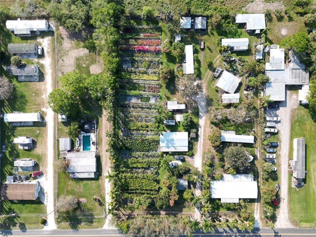 TWO FOR ONE! A Beautiful Nursery and 3 rental Income properties on site. 1.34 acres located 1 mile from Lake Okeechobee! one doublewide with screen room, one singlewide with porch, and an park model with porch. Metal roofs are approximately 3 years old, City water, private septics. Fenced, central ac/heat on 2 of the units, a window unit on the park model. Nursery has many mature fruit trees, a variety of mature palm trees, and various plants and schrubery. A must see! Run your business, and live on site, AND produce rental income! Call today for a private showing. (an additional 5 unit mobile home park is for sale two parcels down, we can do a package sale if desired)