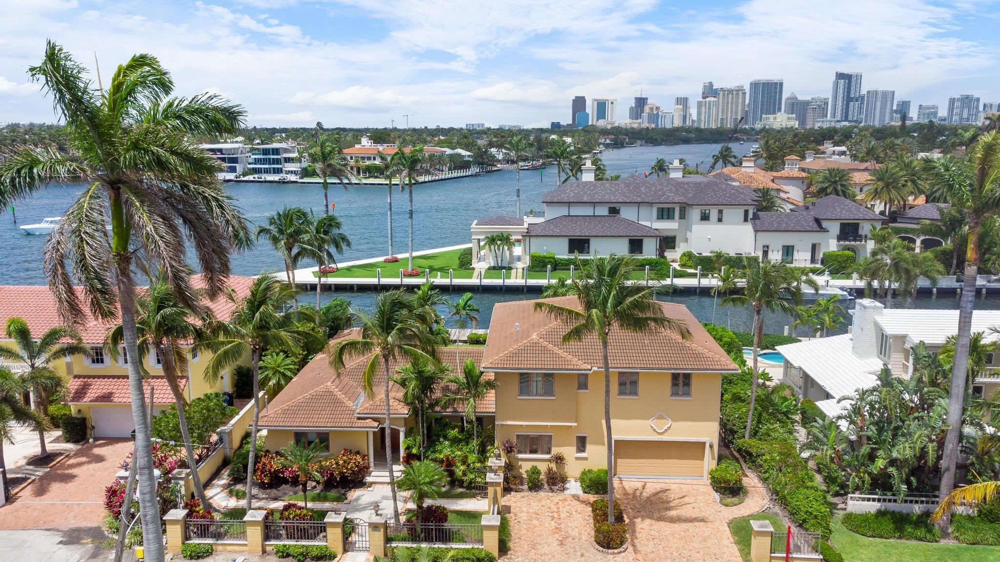 Offered fully furnished and decorated with a beautiful view of the intersection of the Intracoastal and the New River, desirable South Las Olas location. Huge master suite with walk-in closets, his and her bath, walk to the beach & shopping. 100' of dock space. Build your new home and live here through the process.