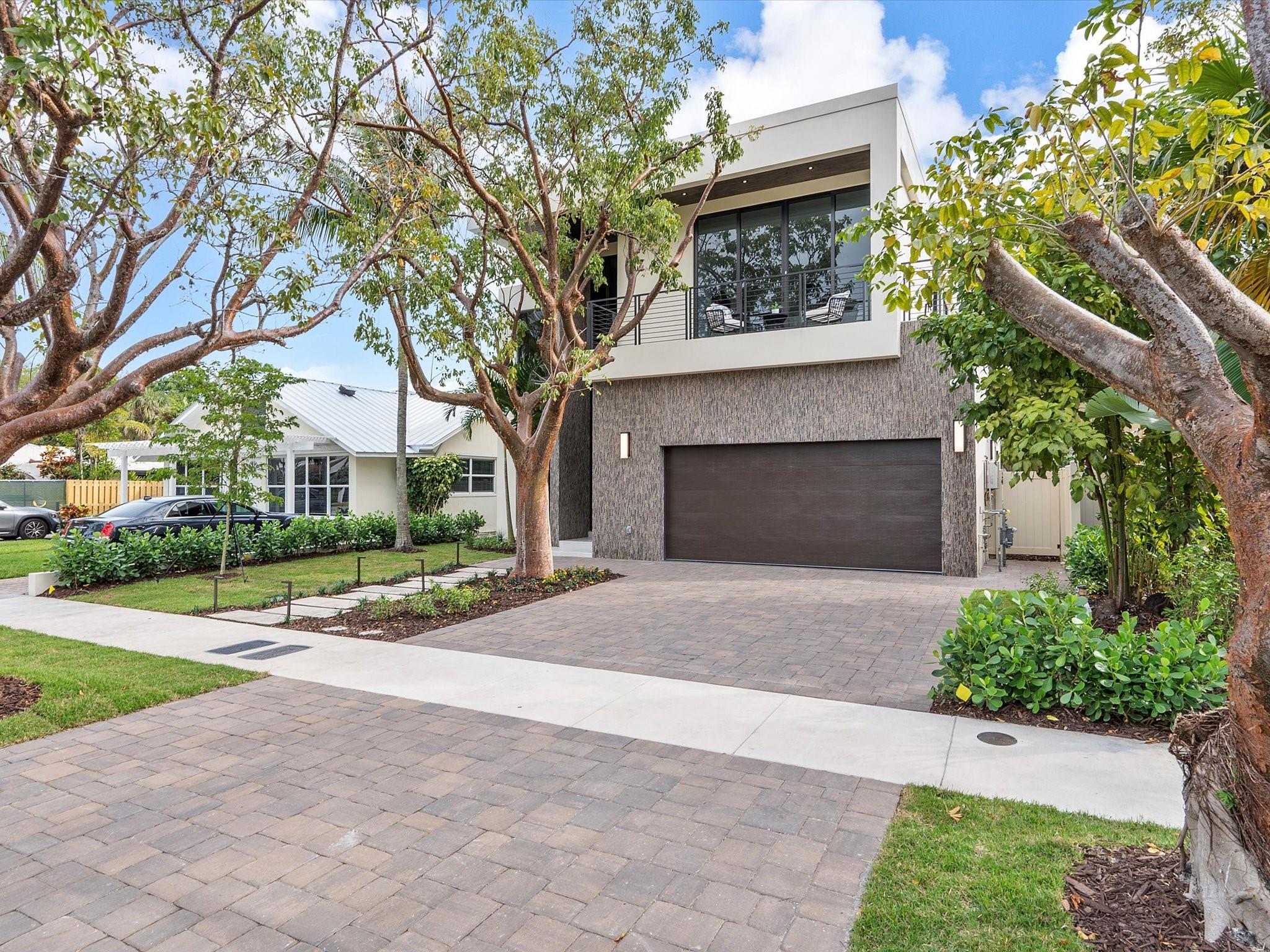 LUXURY AND LOCATION! This custom luxury home is nestled in the heart of the highly sought-after Rio Vista neighborhood in Fort Lauderdale. The spacious two-story residence boasts 5 bedrooms, 4 bathrooms, a pool, a large 2.5-car garage, an amazing wraparound balcony, a gourmet kitchen with all Miele appliances, custom cabinetry, high-end bathroom finishes, high-quality large-format flooring, and grand entertainment spaces spread across 4,000 square feet under air. The home is equipped with smart features, offering a plethora of functionalities. Built by experienced builders and developers renowned for delivering luxury homes in Rio Vista. Enjoy life with a short walk to Las Olas, local beaches, or stay home and relax by the pool in this one-of-a-kind residence.