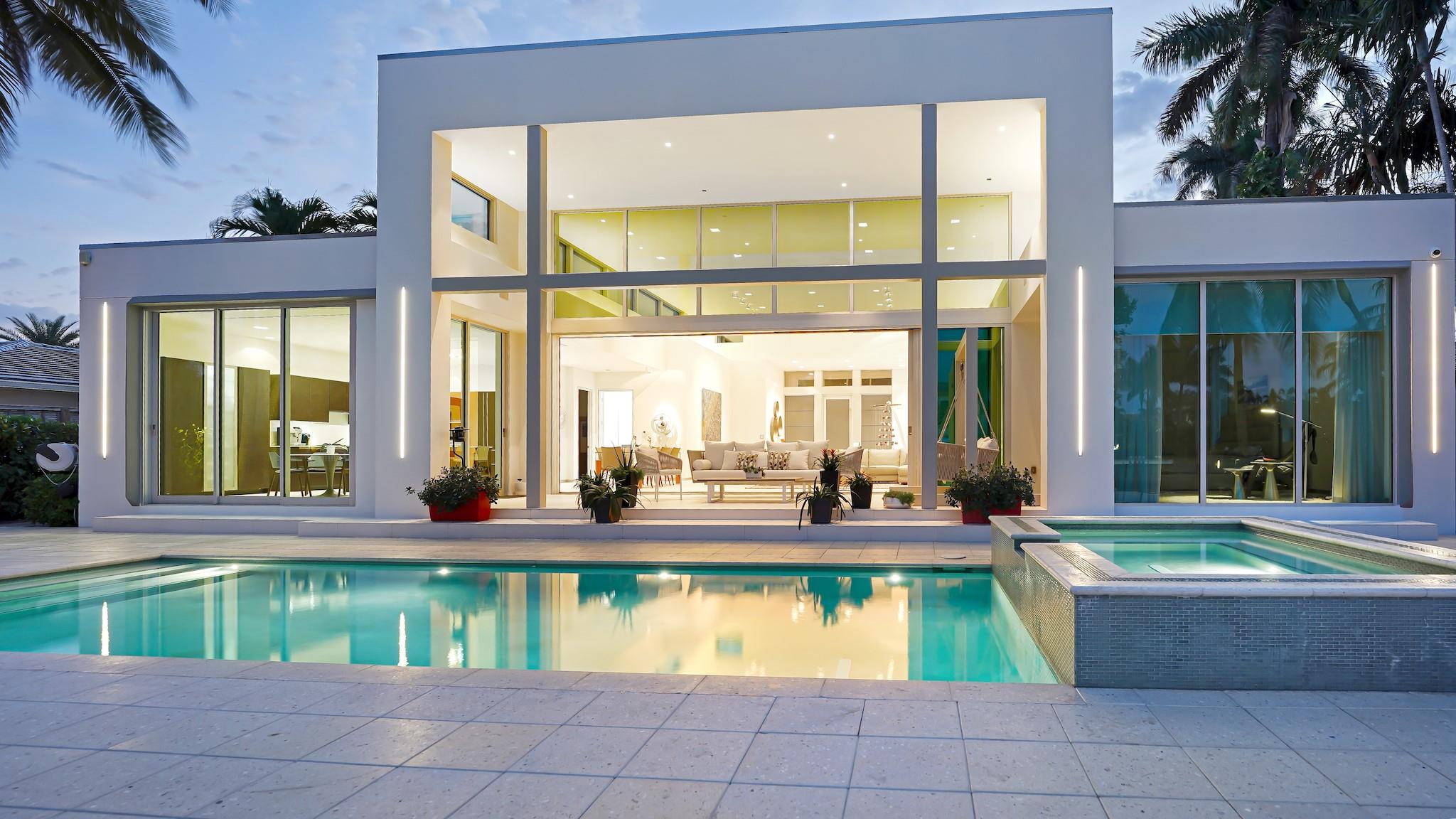 Discover a rare one-story contemporary waterfront in Seven Isles Las Olas neighborhood. Designed by architect John Gerra, this residence epitomizes seamless integration of modern elements. Gerra's expertise blends materials & techniques, creating spaces w/ natural light by day & LED ambiance by night. Reglet base & door framing. Enter Fleetwood glass door, then greeted by soaring 17-foot spaces adorned w/ transom glass & accentuated by fully retractable sliding glass. A single-level pool deck seamlessly extends to the concrete-pavered dock w/ LED pile lighting. Motorized shades, Crestron control, SieMatic German cabinetry cabinetry, Sub-Zero/Wolf appliances, tankless gas water heaters, natural gas cooking + generator, whole-house water filtration & an epoxy decked oversized garage.