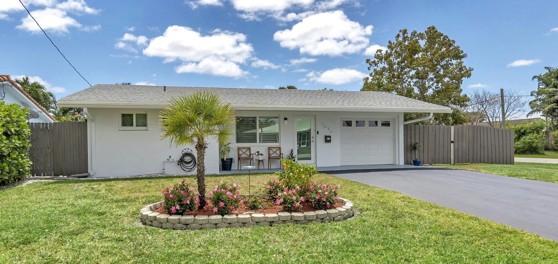 Welcome to this meticulously renovated waterfront dream home in Snug Harbor - Pompano Beach! Only 1 fixed bridge! Move-in ready! Open-concept two bedroom/two bath home with bonus room/garage. This home features a newer roof (2021), impact windows and doors, plantation shutters, quartzite countertops, stainless steel appliances, and porcelain tile throughout. The large, fenced-in corner lot with in-ground swimming pool, 30' waterfront, and boat davits provide a beautiful outdoor space for entertaining and boating. Just one mile away from the Atlantic Ocean. Schedule a showing today. OWNER/AGENT