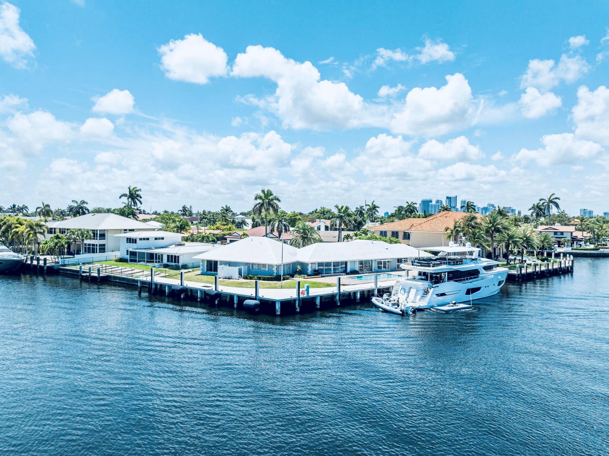 RARE OVERSIZED POINT LOT! DOCK 2 MEGA-YACHTS! LAND SALE. 345' deepest waterfront in Ft Lauderdale (10'+ @MLT) STRAIGHT LINE DOCKAGE for yacht up to 164' +/-, plus room for smaller boats. 2 combined lots are 26,000 SF. EXPANSIVE PANORAMIC VIEWS! Sunrise Key, the next Harbor Beach, is quiet, secure, gated, all-waterfront community near Las Olas. Architectural plans by renowned architect included (15,000 SF 3-story, 7 BR, 10+ car garage, gym, gun range, 2 offices, 3rd floor pool/spa, party room + kitchen). New seawall & dock has large cleats & four 200 amp power stations. LAND SALE but two homes on property are livable + garages & pool. Near Las Olas & easy access to shopping, beaches & best private school in South Florida. THIS HAS IT ALL!  PLEASE DO NOT GO ON PROPERTY WITHOUT LISTING AGENT.