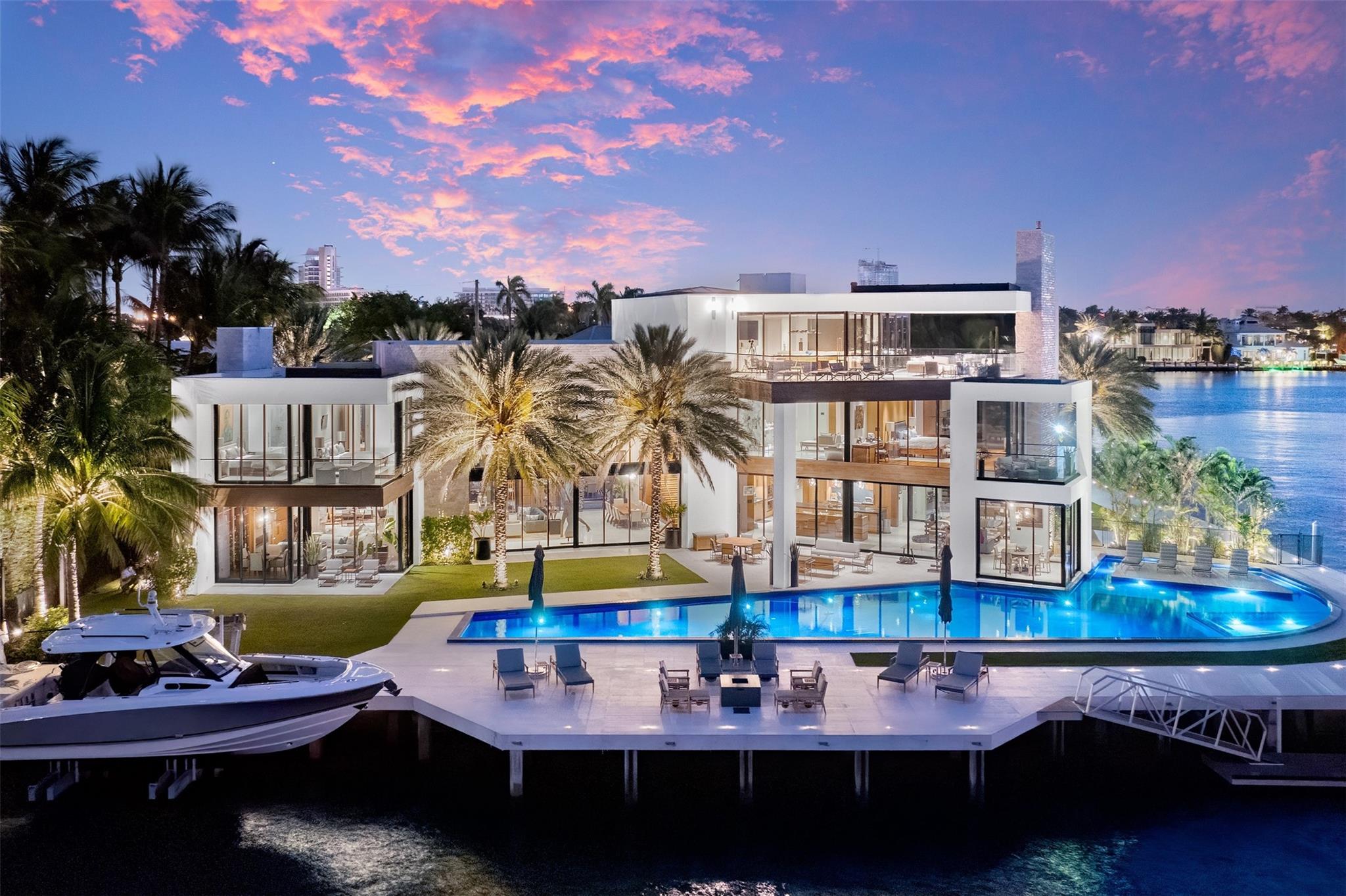 The epitome of ultra luxury living in prestigious Harbor Beach. With Intracoastal views & 298’ WF, this point lot estate offers a seamless blend of modern sophistication & timeless elegance. Find unparalleled lifestyle within w/ impeccable attention to detail & the highest quality materials/finishes throughout. Spanned across 3 floors, find luxury at every turn w/ marble & wood floors, state of the art security system, smart home capabilities & expansive third floor lounge w/the best views in the City. Voluminous ceilings, commercial grade elevator, 4 fireplaces, 6 wet bars & an astounding +/- 90’ lap pool are just some of the many amenities. Lounge by the infinity-edge pool, soak in the sun on the terrace, or embark on a sunset cruise from your private dock. The possibilities are endless.