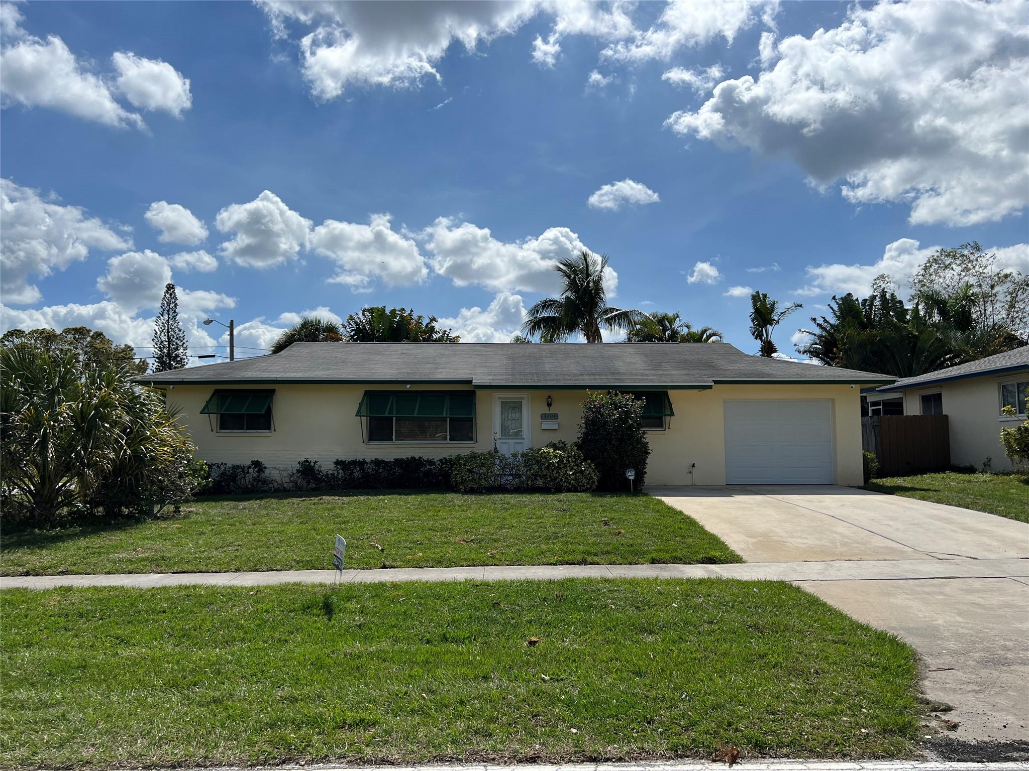 PRICE JUST REDUCED!! COZY 3/2 CORNER LOT HOME IN PALM BCH. GARDENS FLORIDA, FEATURING A 1 CAR ATTACHED GARAGE, IN-GROUND POOL WITH SCREEND LANAI PATIO. LOTS OF PARKING FOR YOUR BOAT OR WINABAGO. TILE THROUGH OUT. CORPORATE OWNED, SEE ATTACHED SELLERS ADDENDUM.