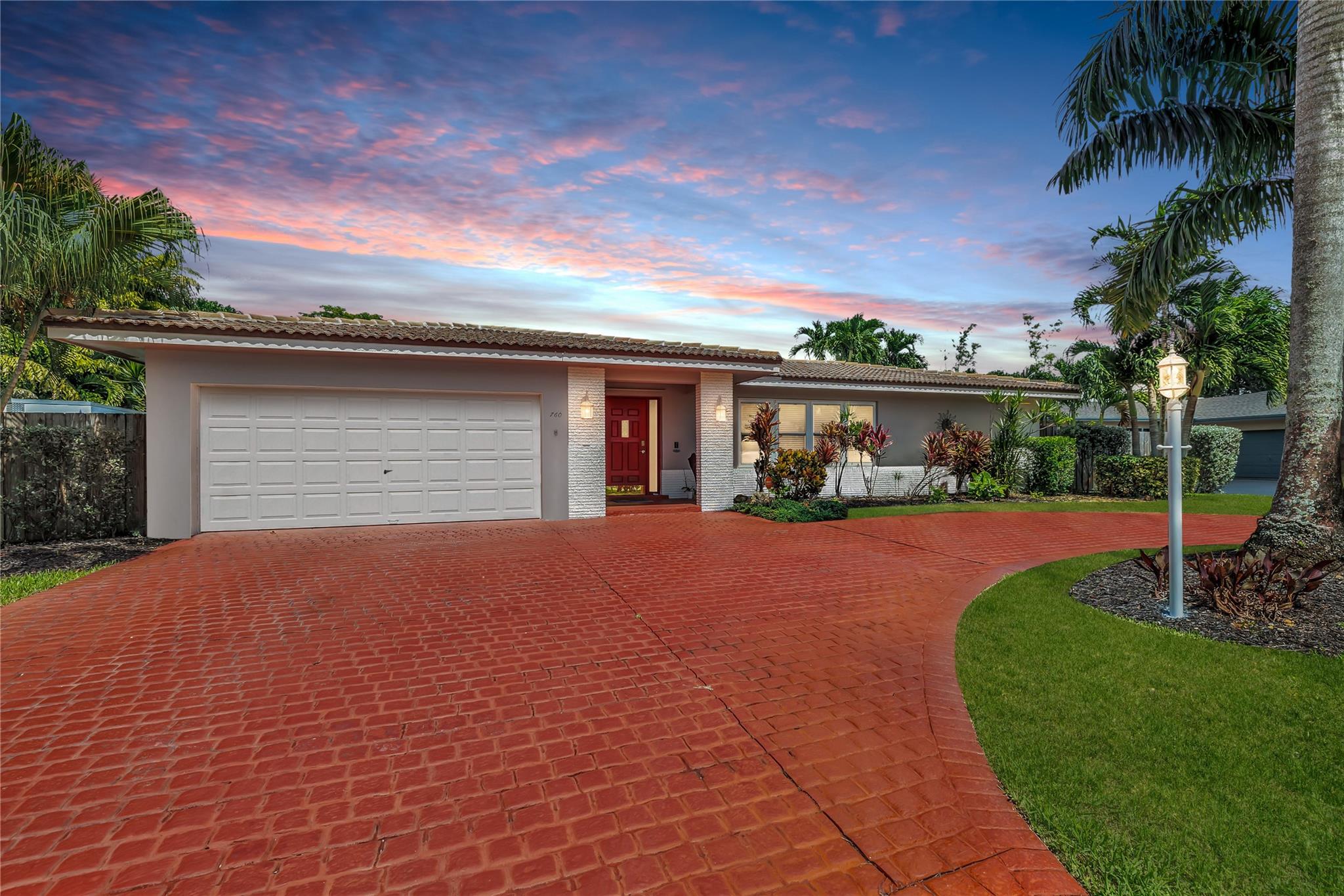 Located in a vibrant town full of opportunities, this beautiful home is just minutes from the Broward Mall and Sawgrass Mills Mall, with easy access to major highways. This sought-after Capri floor plan 4/2 in a true split layout, with the primary bedroom on the right and secondary bedrooms on the left. The kitchen features contrasting cabinets, stainless steel appliances, & a wonderful view, perfect for keeping an eye on the kids while cooking. Adjacent to the kitchen are spacious living, family, & dining rooms, providing ample space for family & guests. The covered patio and large saltwater pool—recently updated with new marcite, tiles, light, pool pump, pipes, and jets—are ideal for entertaining. A wrap-around fence ensures privacy and safety for kids and pets. Stay Friendly!