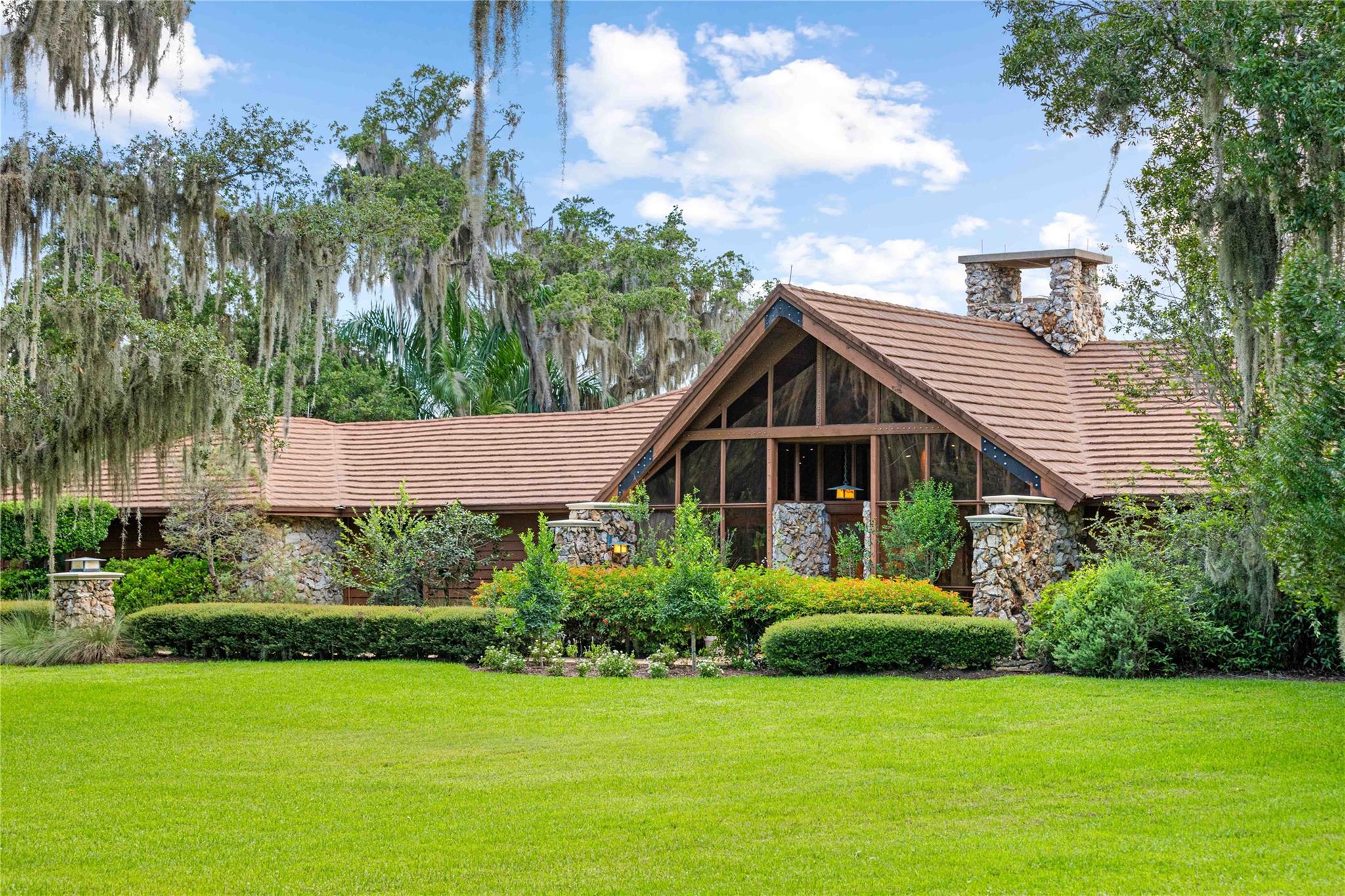 This luxurious cedar and stone riverfront lodge located on the St. Lucie River will capture your heart!  Surrounded by moss draped oaks, this 3,667 square foot architectural masterpiece sits on a .99 acre professionally landscaped lot. A secluded 40 foot long pool, awaits your pleasure.  Follow the path to the river and your own boat dock with deepwater access and only one fixed bridge. Upon entering the home, view soaring cedar ceilings and an immense, double-sided stone fireplace.  Follow the beauty of travertine floors to see the pool through the enormous glass wall before you. You have found the home of your dreams, you muse, as you continue through the 4 bedrooms, large dining room and gourmet kitchen large enough to handle the best of parties you are dreaming of having in the future.