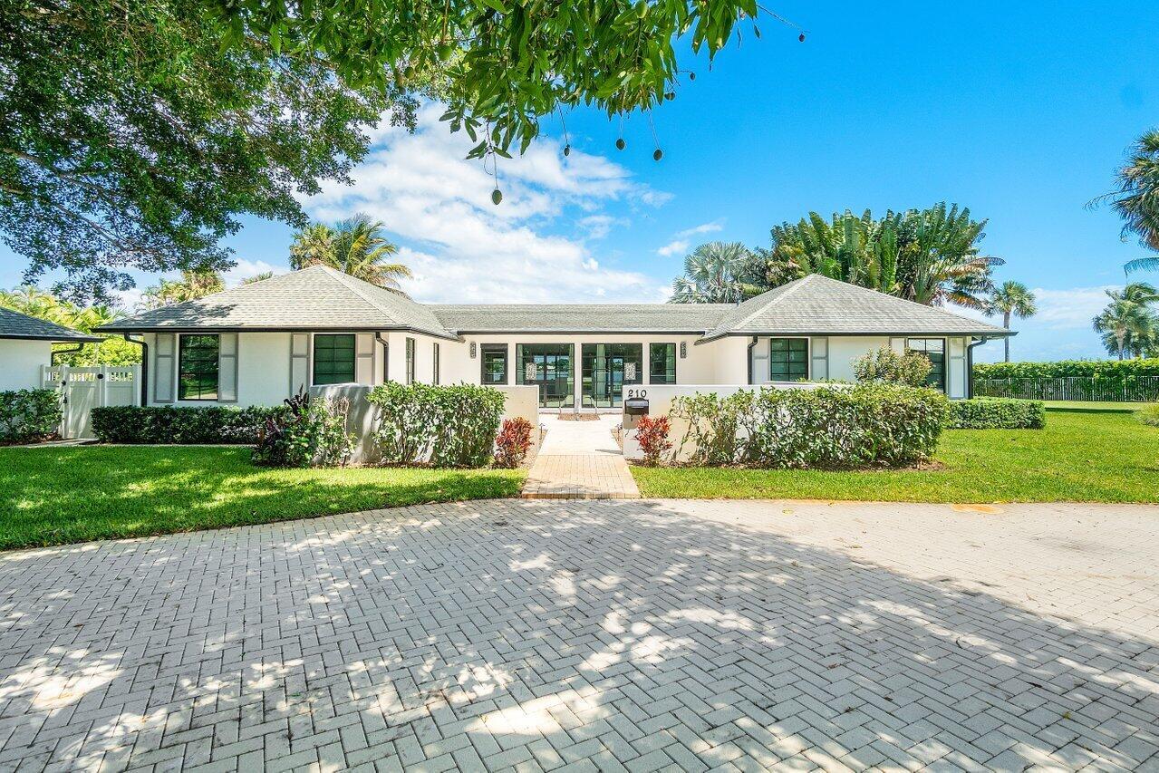 LUXURY INTRACOASTAL HOME and Guesthouse with GORGEOUS WATER VIEWS! Complete renovation completed in 2022 but with a historical provenance. Designed by Architect Cynthia Spray & renovations completed by Gast Construction Group of WPB. Through the front doors you will be wowed by instant views of the Intracoastal Waterway and the amount natural light that shines through full length Impact Glass windows and doors. The gorgeous kitchen features luxury appliances including a induction range, wall oven), quartz countertops. Luxury spa like bathrooms. The Guest House Features a small lvg area plus a full bedroom & bath. built in outdoor grill, pool & green space is perfect for entertaining guests. Walk to Beach & Waterfront Dining. COASTAL LIVING AT ITS FINEST!