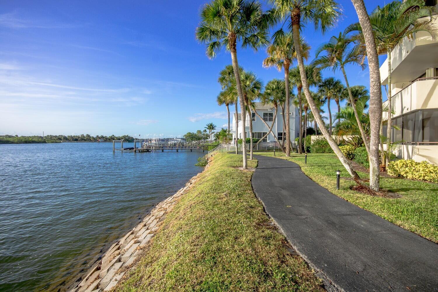 EXCELLENT LOCATION at Jupiter Inlet within walking distance to Jupiter Beach and Jupiter Inlet Entertainment, as well as Harborside. Owner MOTIVATED to Sell. Single Family 3 Bedroom, 2.5 bath 2 story with 2 car garage and ample storage. DO NOT LET THIS ONE GET AWAY. Gated, community pool, tennis/pickleball courts, deep water marina, walking path along the Intracoastal  and Inlet, charming interior boardwalks with gazebos. New balcony with Intracoastal view, tile roof 2016, complete hurricane protection. large covered porch for outdoor  entertainment & BBQ. Courtyard entrance, covered garage access with pull down stairs. Room to build-up over the garage if you want to expand. Marina slips for sale or rent, boat, beach, dine within walking distance. Large dogs allowed. Easy to show