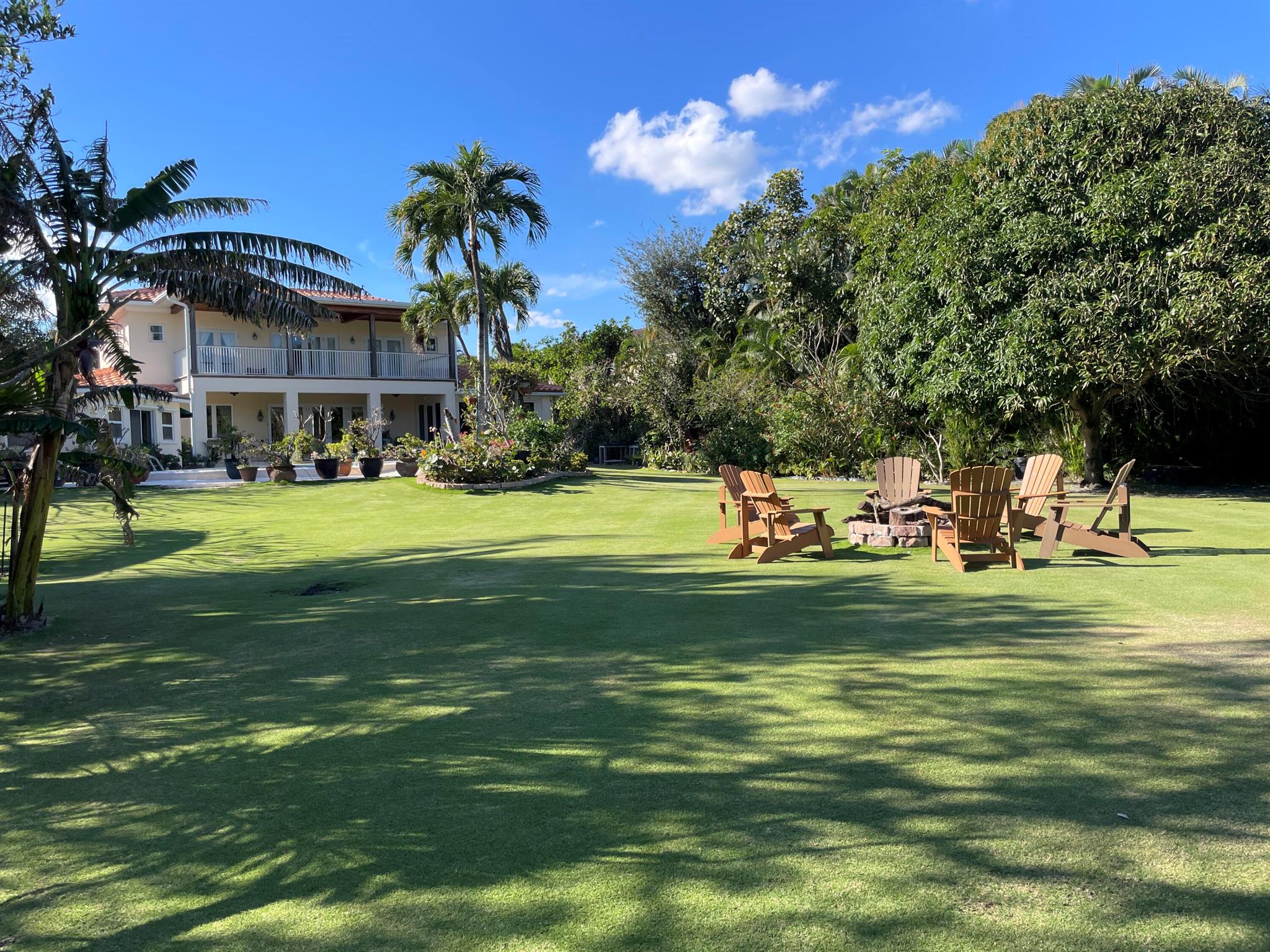 Enjoy peace, privacy, and the ocean breeze from this sprawling 5 bedroom waterfront estate. Oversized 31,000+ lot directly across from nature preserve. With beautiful views of the sunrise, nature, and wildlife, enjoy 100 feet of waterfrontage with private dock and ocean access. Designed by Roger Janssen and custom built with stem wall foundation and CBS construction, additional features include an air conditioned 3 car garage with large finished attic studio, detached guest house with full bathroom, library, high ceilings, impact glass, swimming pool and abundant green space with several varieties of exotic fruit trees. Do not miss this rare opportunity to own one of the best lots and locations in Hypoluxo Island very close to the beach, Eau Palm Beach, Palm Beach, I-95 and PBI airport.