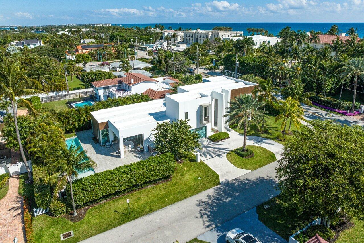 RESIDENCE: A cohesive interplay of rich stone, pristine white stucco and gleaming glass, this tropical Contemporary-style residence, designed with simple, clean, rectilinear lines by architect George Brewer, offers a rare opportunity to enjoy the coveted ''Now'' Florida tropical lifestyle. With five bedrooms and 6,214 +/- total square feet, it truly presents as an impressive artistic masterpiece that makes a singular statement, sure to please its discerning owner. Details throughout include striking large-format tile flooring; a soothing white-on-white color palette; a light-filled, bright and open ambience; and window walls of glass that blur the boundary between inside and out creating a mesmerizing union with nature. Introduced by the remarkable two-story foyer and stair hall, the dramatic main gallery is enclosed in glass, offering serene views of the beautifully landscaped front yard and side gardens. In the main wing in an open-floor-plan configuration, the family room and dining room are open to the center-island chef's kitchen, finished with contemporary cabinetry, stainless-steel professional-grade appliances and a wall of sliding doors that lead to the loggia. Also in this wing are a guest bedroom suite with a private patio, a powder room and laundry. Set apart in a wing of its own is the stunning primary suite. It comprises a large bedroom with sliding doors that open to the side yard, two custom-fitted walk-in closets, and a magnificent stone-clad bathroom with dual sinks, a huge shower and a lounge tub. On the second floor in a split-bedroom plan, the VIP bedroom suite is placed separately from the guest bedroom suite and the gym. Additional details of note: the VIP bedroom accesses a private balcony, and the gym easily can be repurposed to serve as another guest bedroom. Also, this residence has easy beach access; it is integrated with Smart Home technology, and windows and doors throughout are impact-glass.

PROPERTY:

Across the street from the ocean on an oversized beautifully landscaped corner lot, the driveway circles around an oasis to the two-car garage and spectacular entry adjacent to a tranquil water feature. Inviting indoor/outdoor entertaining in the hedged back yard, the covered loggia, wrapped within an expansive deck, overlooks the 55-foot pool with a sun shelf and a stone feature wall with soothing fountain sprays. Additional amenities for easy living are the summer kitchen/barbeque area, easily accessible from the kitchen, and the outdoor shower, convenient when returning from the beach.




DISCLAIMER: Information published or otherwise provided by the listing company and its representatives including but not limited to prices, measurements, square footages, lot sizes, calculations, statistics, and videos are deemed reliable but are not guaranteed and are subject to errors, omissions or changes without notice. All such information should be independently verified by any prospective purchaser or seller. Parties should perform their own due diligence to verify such information prior to a sale or listing. Listing company expressly disclaims any warranty or representation regarding such information. Prices published are either list price, sold price, and/or last asking price. The listing company participates in the Multiple Listing Service and IDX. The properties published as listed and sold are not necessarily exclusive to listing company and may be listed or have sold with other members of the Multiple Listing Service. Transactions where listing company represented both buyers and sellers are calculated as two sales. Cooperating brokers are advised that in the event of a Buyer default, no financial fee will be paid to a cooperating Broker on the Deposits retained by the Seller. No financial fee will be paid to any cooperating broker until title passes or upon actual commencement of a lease. Some affiliations may not be applicable to certain geographic areas. If your property is currently listed with another broker, please disregard any solicitation for services. Copyright 2024 by the listing company. All Rights Reserved.