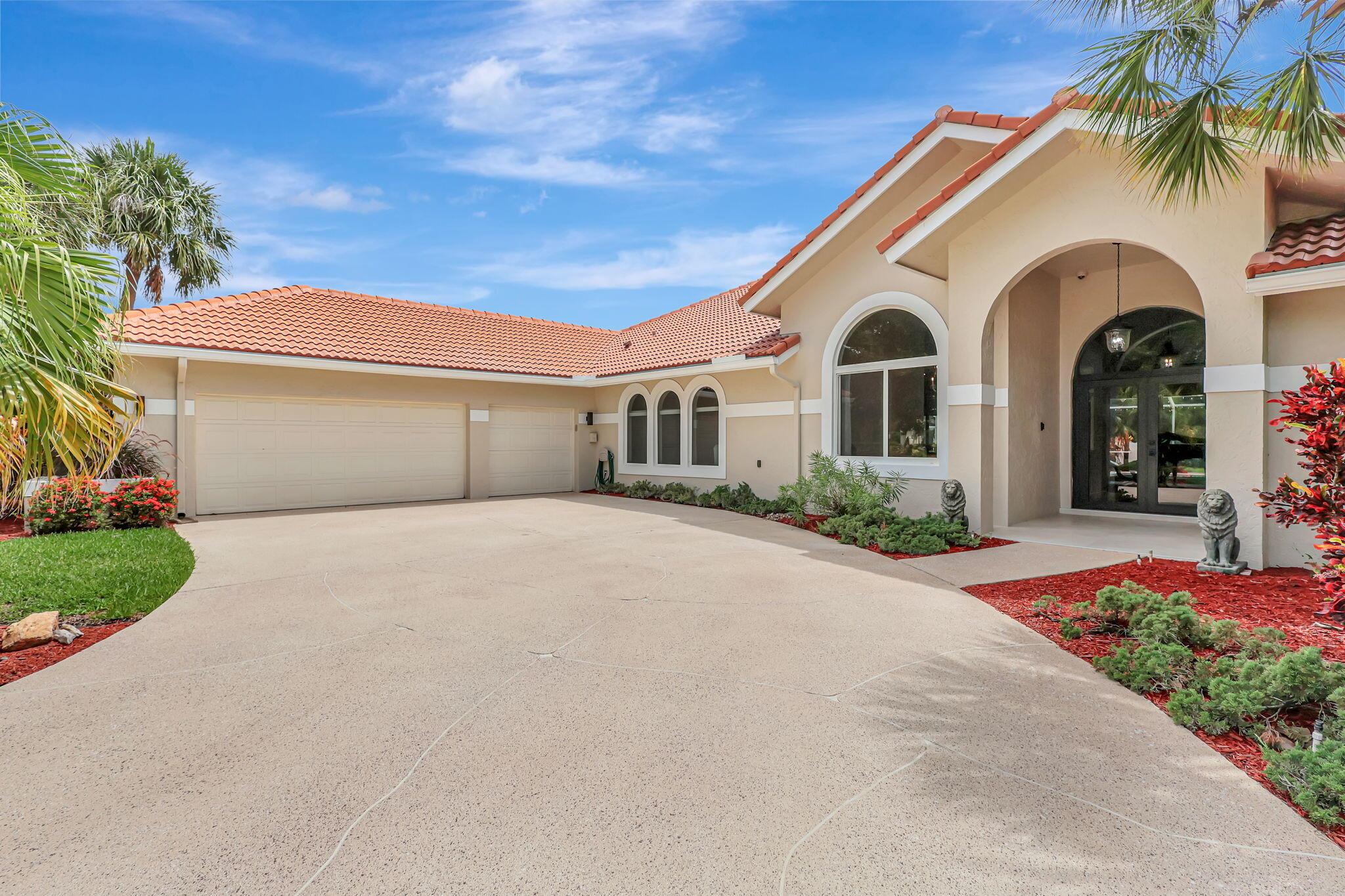 Imagine yourself in this sophisticated residence within the coveted Banyan Lakes gated community! Set on a lush, sprawling acre, this freshly painted abode presents a stunning interior with vaulted ceilings, stylish tile flooring, and upgraded impact windows. The entertainer's kitchen features stainless steel appliances, abundant cabinetry, and granite countertops extending to the multi-seater island. Your primary suite steals the show with its coved ceiling, walk-in closet, and convenient ensuite. A resort-inspired screened-in patio is ideal for gatherings by the pristine pool. Notables include brand-new roofing, an attached oversized 3-car garage, access to community amenities, and activities such as kayaking, water-skiing, and swimming. Come for a tour before it passes you by!