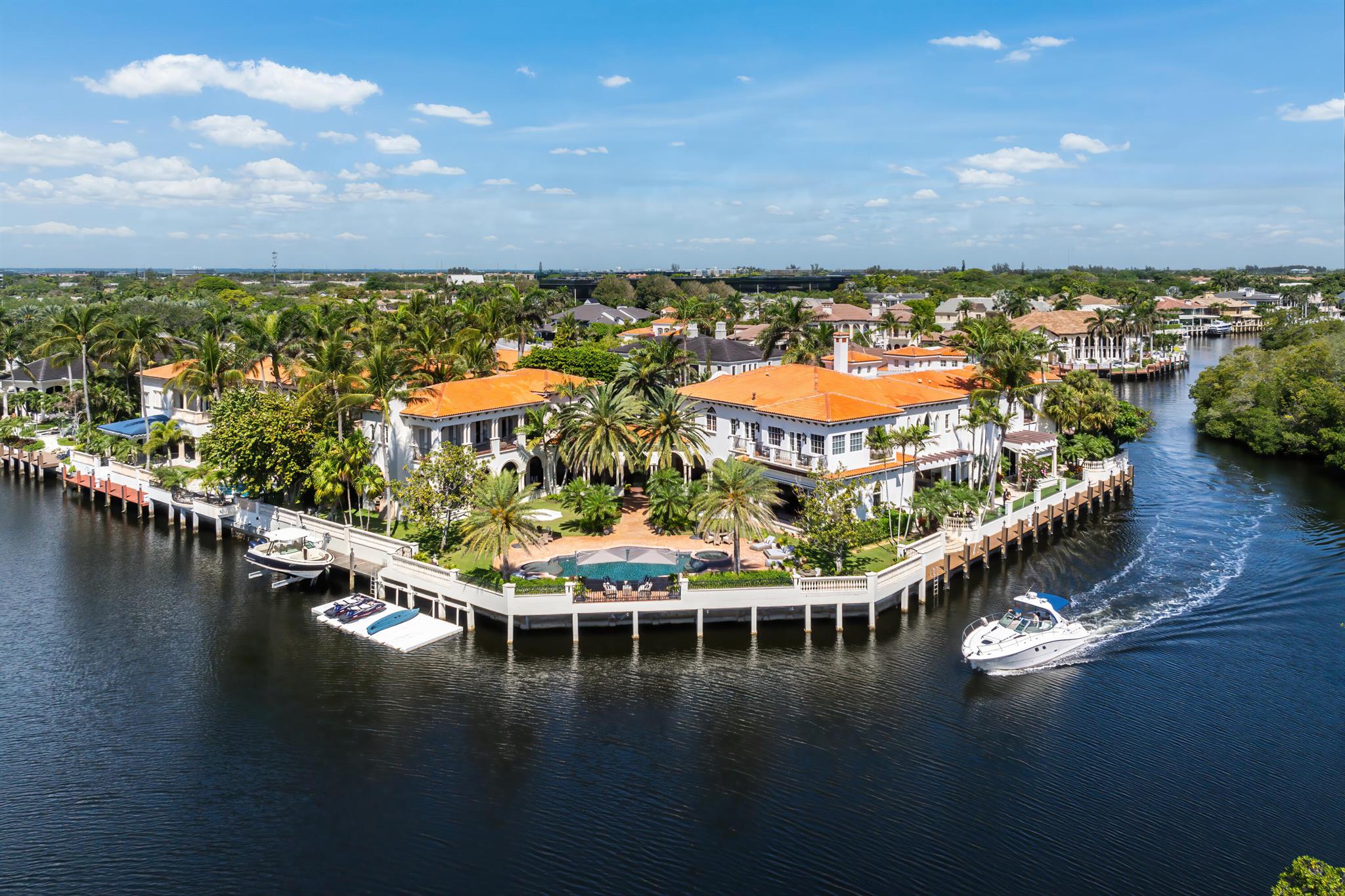 Totally updated, magnificent Mediterranean estate with 350 ft of water frontage elegantly situated on a double point lot in The Sanctuary, the most exclusive and highly sought-after luxury enclave on the Intracoastal in Boca Raton. The sprawling estate is a yachtsman dream with two deep water docks-one approx. 150' ft long and frameless glass railings for visibility. There are multiple covered loggia, one with outdoor entertaining area, gas fireplace, and bocce court, impeccably manicured landscaping, and heated swimming pool. 3 half baths, a Skibo room with incredible wood detail, stained glass windows, wine cellar and full bar, two laundry rooms (one upstairs, one down), a captain's suite with fast access to the dock, a plentiful 5 car garage (3 doors, 2 tandem spaces), expansive master suite, library/office space, sauna. Additional features include: A bedroom has been transformed into a theater room, 2/2 Guest house with full caterer's/chef's kitchen, outdoor kitchen with top-of-the-line appliances, beautiful breezeway, automatic over-sized retractable awnings, multiple balconies facing the intracoastal, pecky cypress ceiling details, and more. The perfect example of a wonderfully executed transition between old world charm with contemporary finishes.

"The Sanctuary is a guard-gated yachting enclave featuring a 20-slip marina, 2 Har-Tru tennis courts, a multifunctional sport court, playground/park, and 27-¦-acre bird/wildlife preserve - all in the utmost seclusion with private land and water uniformed security roving patrols and concierge services.  It is listed in Forbes Top Ten Most Exclusive and Expensive Gated Communities in the United States."