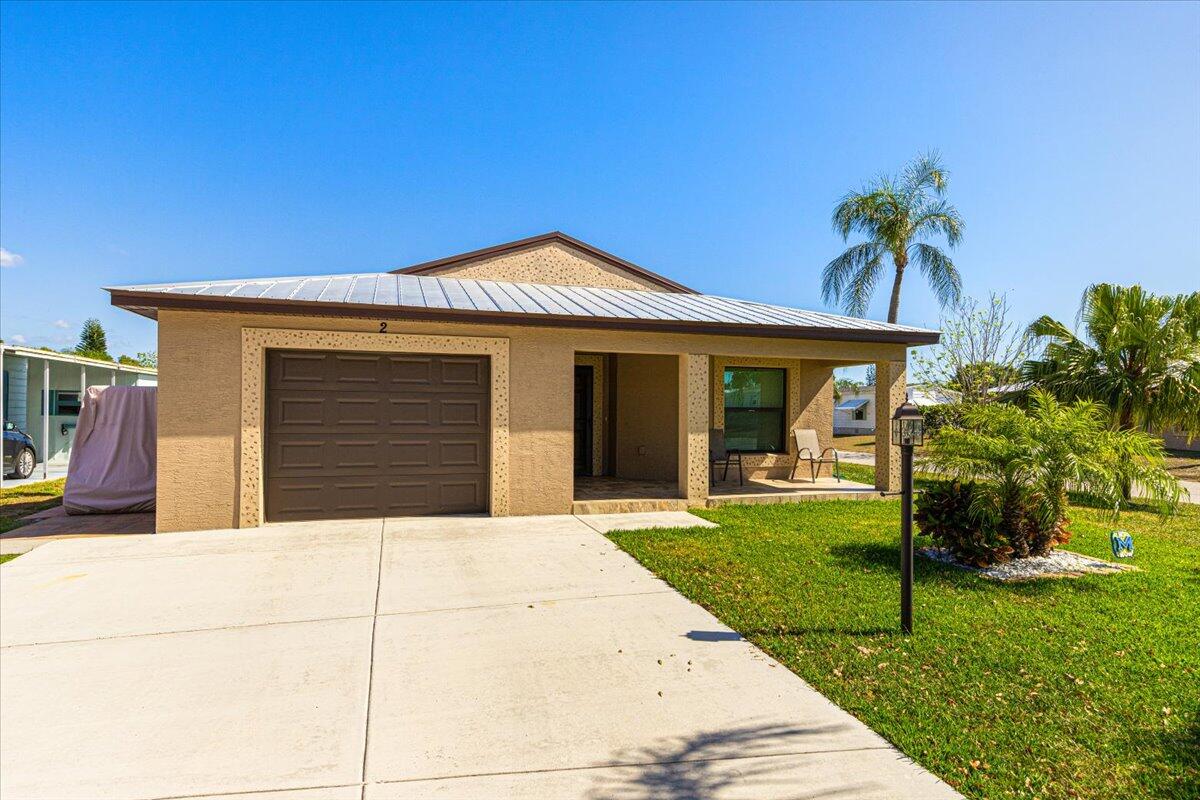 Immaculate home, cleaner than new! This home was constructed in 2020 but you would never know that looking at it, upon entering, you are welcomed with a fresh clean scent and not a spot of dust to be found! Situated on a corner lot, home comes with a metal roof, hurricane impact windows, whole wired ready for a house generator, granite kitchen with beautiful cabinets, laminate floors throughout, not an inch of carpet, the rear 10x 20 porch has upgraded floors along with privacy blinds. You do not want to miss this opportunity to live in 55+ community no HOA, land lease only of just $719.79 a month which includes the use of a Private golf course ( no fees to play,) 2 pools, pickleball, tennis, shuffleboard, bocce, gym, library, cards, Mah jong, bible study,wood workshop, golf cart parades,