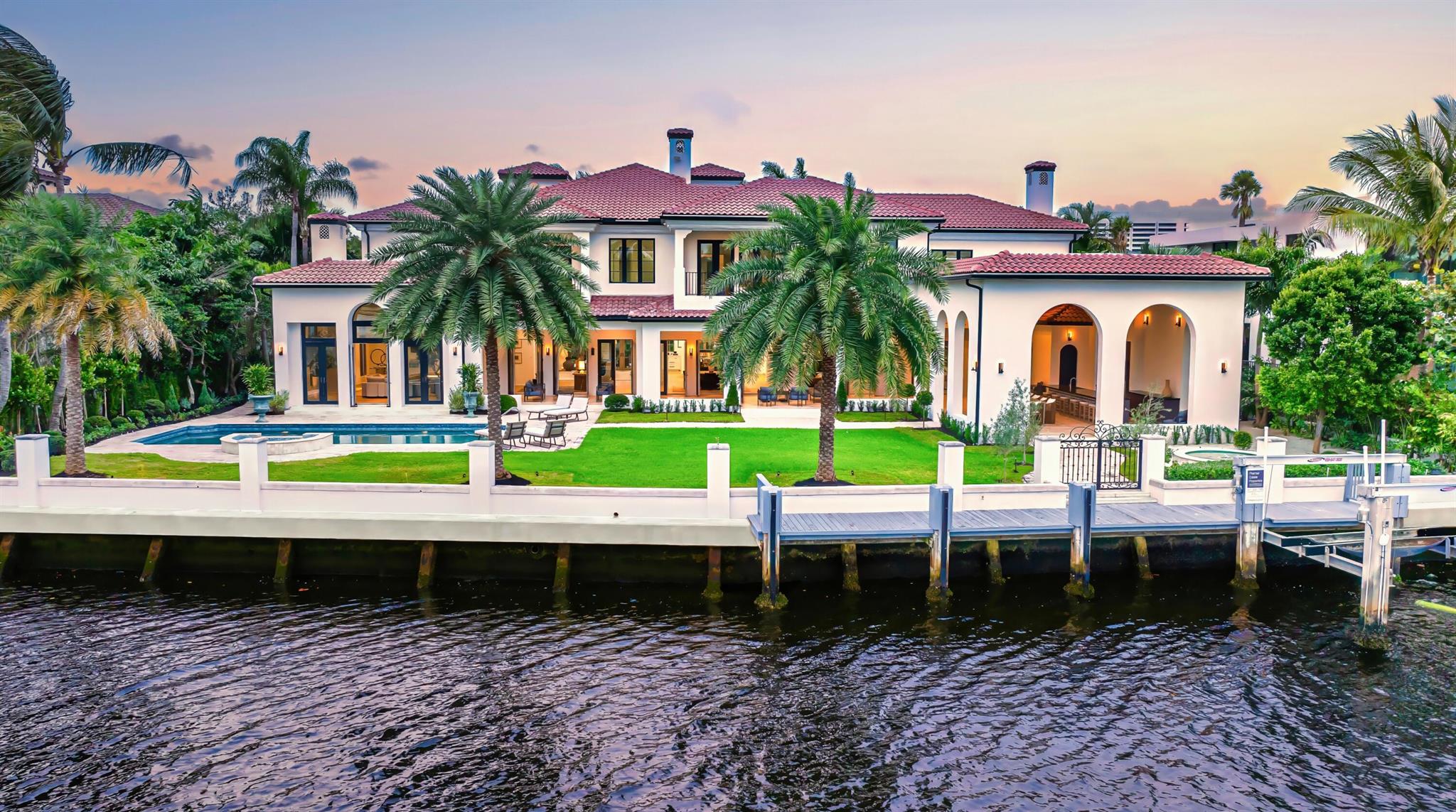 Ideally situated just blocks from the beach in Boca Raton's prestigious Estates Section, this newly remastered intracoastal estate marries California chic with classic Spanish design. Artfully crafted in 2003 by Dan Swanson of Addison Development in Palm Beach, this bespoke two-story residence has just been reimagined and transformed into a new modern Spanish Villa, capturing the essence of California coastal estates in Montecito. Inside the residence, walls were altered to create a chic, clean feel with dreamy white walls, crossbeam ceiling, modern fireplaces, studio can lighting, wide plank bleached oak floors, and a more sculptural front staircase. All to further streamline the fresh open plan, and amplify the wide gentled arches that are the focal point of this architectural design. DISCLAIMER: Information published or otherwise provided by the listing company and its representatives including but not limited to prices, measurements, square footages, lot sizes, calculations, statistics, and videos are deemed reliable but are not guaranteed and are subject to errors, omissions or changes without notice. All such information should be independently verified by any prospective purchaser or seller. Parties should perform their own due diligence to verify such information prior to a sale or listing. Listing company expressly disclaims any warranty or representation regarding such information. Prices published are either list price, sold price, and/or last asking price. The listing company participates in the Multiple Listing Service and IDX. The properties published as listed and sold are not necessarily exclusive to listing company and may be listed or have sold with other members of the Multiple Listing Service. Transactions where listing company represented both buyers and sellers are calculated as two sales. Cooperating brokers are advised that in the event of a Buyer default, no financial fee will be paid to a cooperating Broker on the Deposits retained by the Seller. No financial fee will be paid to any cooperating broker until title passes or upon actual commencement of a lease. Some affiliations may not be applicable to certain geographic areas. If your property is currently listed with another broker, please disregard any solicitation for services. Copyright 2024 by the listing company. All Rights Reserved.