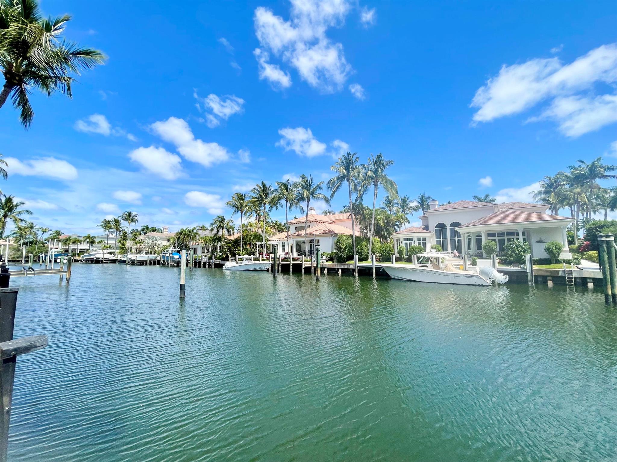 UNDER APPRAISED VALUE! Bring your 70 ft yacht and water toys. MODEL PERFECT. EVERY ARCHITECTURAL UPGRADE.  Custom estate w/expansive east water views minutes to intracoastal. Harbour Isles is a 24hr manned gated luxury boutique waterfront enclave. Five large bedrooms each ensuite. Den/Gym. Office. Spacious primary wing boasts a breakfast bar, large custom closets, sitting room and balcony.  Spacious loft guests to relax or playroom.  Chefs kitchen w/huge pantry. Lush landscaping surround a resort style heated pool/spa. Large patio for entertaining! Summer kitchen. Impact walls of glass let the outside in. Other features include motorized shades, dramatic FP,2 story ceilings, marble staircase.  Immense circular driveway w/3 car garage. Trex Dock for easy Maintenance. New roof and ACs.