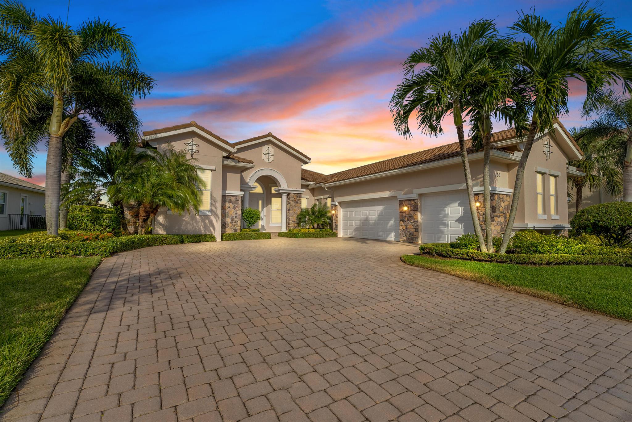 Prepare to be captivated by this exquisite residence in Jupiter Country Club, set against the backdrop of breathtaking golf and lake views.As you step into this remarkable home, you'll be greeted by an elegant seating room designed for entertaining with large open windows and the backyard as your conversation piece. The well-appointed gourmet kitchen leaves no detail overlooked featuring a hooded gas range, custom backsplash, center island, and spacious pantry. The cabinets were just painted white. This culinary haven is perfectly complemented by a sunlit breakfast area and an expansive family room. Sliding glass doors seamlessly connect the indoor and outdoor living spaces, providing direct access to the covered lanai, where alfresco dining and relaxation await a serene sitting area with a bay window, coffered ceiling, and two walk-in closets. The opulent master bath beckons with his-and-her vanities, a Roman tub, separate shower, and a private water closet.
This exceptional home further boasts three guest bedrooms, three additional full baths including a full cabana bath for added convenience. A private study with double doors offers a quiet space for work or reflection, while a separate laundry room ensures practicality. A three-car courtyard garage provides ample space for vehicles and storage while adding to the grandeur of the property.
Experience the unparalleled lifestyle of Jupiter Country Club, where luxury meets tranquility in an exclusive golf community. Schedule your visit today and discover the unmatched elegance and sophistication of this best-selling extended Castania model.