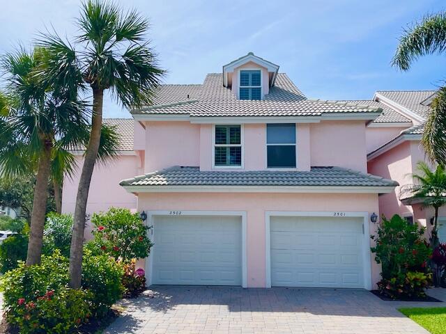 Available 2025 SEASON  $8000/mo.  Walk to the turquoise waters of Jupiter Beach from this 2nd floor, 3 bedroom + loft, 3 full bath end unit residence in the gated, beachside community of The Estuary. Located on the back nine of the Jupiter Dunes Golf Course with views of the golf course & lake, this 3 bedroom residence offers 1st class accommodations with a gorgeous renovation including updated kitchen (granite & stainless steel), 3 updated baths, gorgeous custom moldings, huge water & golf front lanai,  tiled flooring throughout, flat screen TV's, ceiling fans & a 1 car attached garage. Fully equipped for a great summer or winter rental season at Jupiter Beach. Walk to golf, shopping, parks & all of the waterfront restaurants in the Inlet District.