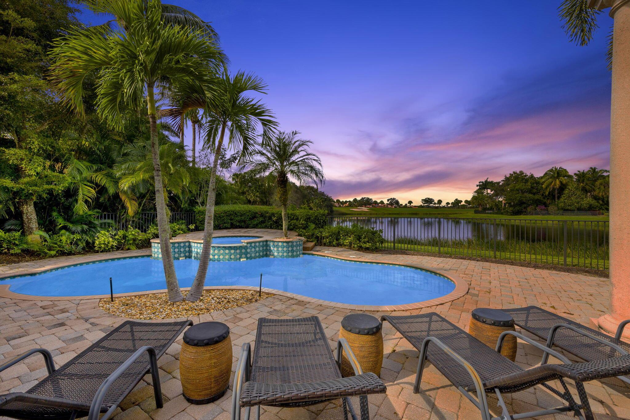 One of the most stunning water Golf Views with western exposure, nestled in Quantera at Mirasol Country Club, GOLF MEMBERSHIP available. This one level masterpiece is walking distance to the club, featuring tranquil sunsets and exceptional privacy. Offering 3,812 square feet of living space, this home offers 3 bdrm, 3 ba, and office on one level providing ample room for  ... comfortable living. The exceptional views seen from the main living areas in the home are surround by lush tropical landscaping, creating a secluded sanctuary. Upon entry, the soaring ceiling and expansive windows in the spacious Living room offer and abundance of natural light. Throughout the home, exquisite details abound, including coffered ceilings, a full wet bar, and a well-appointed office. The kitchen is a delight for culinary enthusiasts, with a gas range, a generous walk-in pantry, wrap-around countertops, central island, open to the family room, with breathtaking views. The primary suite is conveniently located with picturesque views of the expansive lake, golf course and unbelievable sunsets. The VIP guest suites are situated for privacy. The spacious outdoor paradise with newly resurfaced pool, spa and summer kitchen is perfect for relaxing and entertaining. The AC units have been replaced recently. Mirasol Country Club is one of Palm Beach Gardens' most coveted country clubs, boasting a 75,000 square foot clubhouse with multiple indoor and outdoor dining venues, a full-service spa, a state-of-the-art fitness center, a dedicated kids' clubhouse, tennis and pickleball courts, an Olympic-sized pool, kids pool, additional secluded pool and two championship golf courses. This vibrant community offers an array of social activities, special interest clubs and events, ensuring a dynamic lifestyle for its residents.