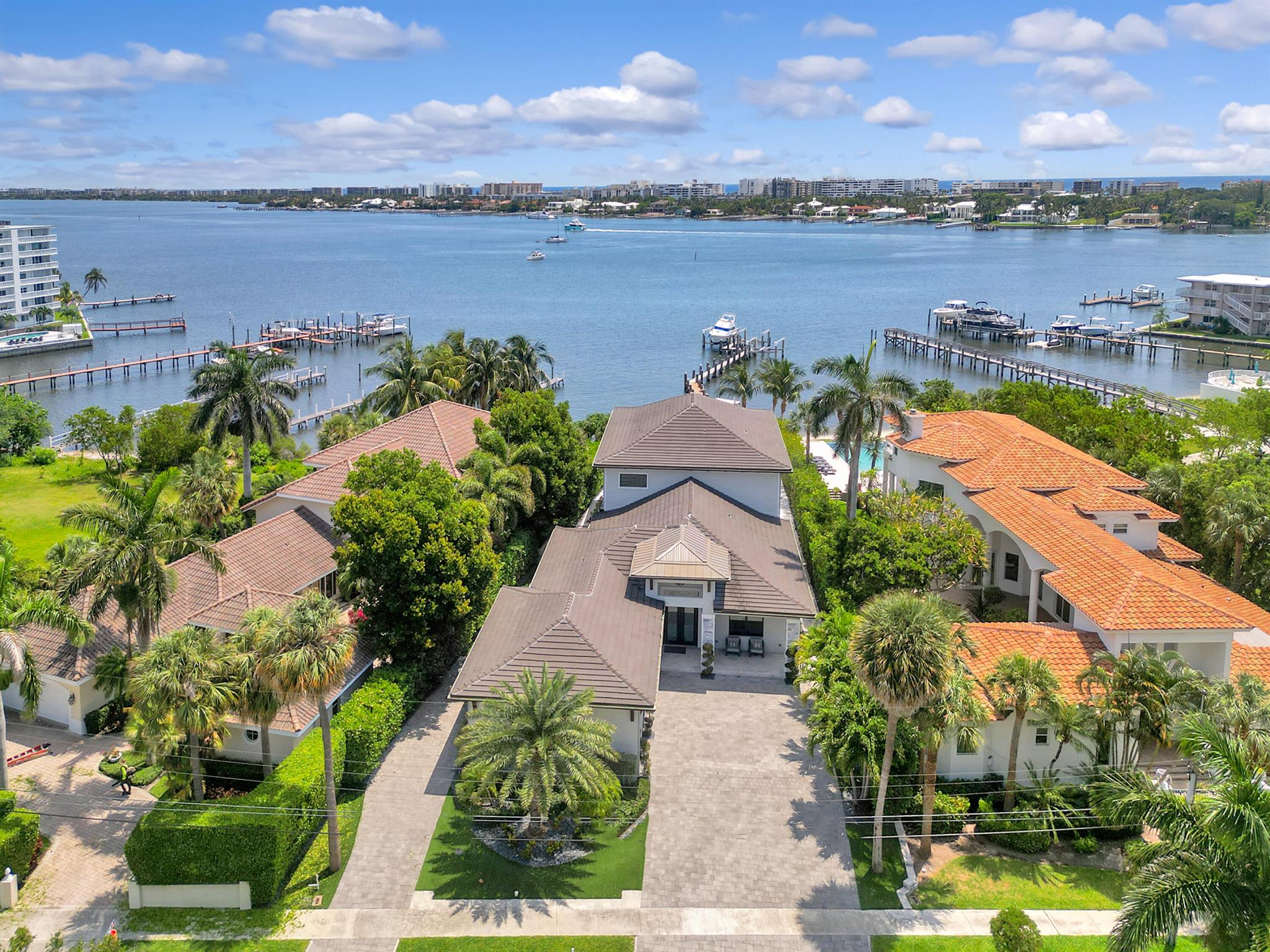 ONE-OF-A-KIND Direct Intracoastal Stunner! This Modern-Contemporary 2019 Build sited on over a 1/3 acre Lot across from the Hypoluxo Island is ready for its new and proud owner. Over 4600 Living SF well-appointed with 5 beds / 5 full baths and an iconic backyard. Completely custom infinity pool with expansive sunshelf, sunken seating area with firepit, swim up bar, beautiful pool deck with astroturf inlays, Summer Kitchen, LED lighting & stacked stone free standing structure with the sleek waterfall - providing the ultimate luxury presence. Designer interior with an incredible kitchen, bar & living space trio. With the feeling of your own private beach, this waterfront GEM is ready for your Boat with easy Ocean access just minutes to the Boynton Inlet. A must see!! ONE-OF-A-KIND Direct Intracoastal Stunner! This Modern-Contemporary 2019 Build sited on over a 1/3 acre Lot across from the Hypoluxo Island is ready for its new and proud owner. Over 4600 Living SF well-appointed with 5 beds / 5 full baths and an iconic backyard. Completely custom infinity pool with expansive sunshelf, sunken seating area with firepit, swim up bar, beautiful pool deck with astroturf inlays, Summer Kitchen, LED lighting &amp; stacked stone free standing structure with the sleek waterfall - providing the ultimate luxury presence. Designer interior with an incredible kitchen, bar &amp; living space trio. Your beautiful kitchen offers a thick quartz countertop with waterfall and carried through the backsplash with custom cabinetry, island, subzero fridge, high grade appliances &amp; opening to your 32 foot fully retractable sliders - creating the most desirable living space. Open concept with a totally remodeled bar, featuring onyx countertops, metallic subway tile backsplash and electric fireplace. Oversized master suite with dome lighting, custom dream closet &amp; private terrace with your million dollar Intracoastal view with plenty of seating area. With the feeling of your own private beach, this waterfront GEM is ready for your Boat with easy Ocean access just minutes to the Boynton Inlet. A must see!!