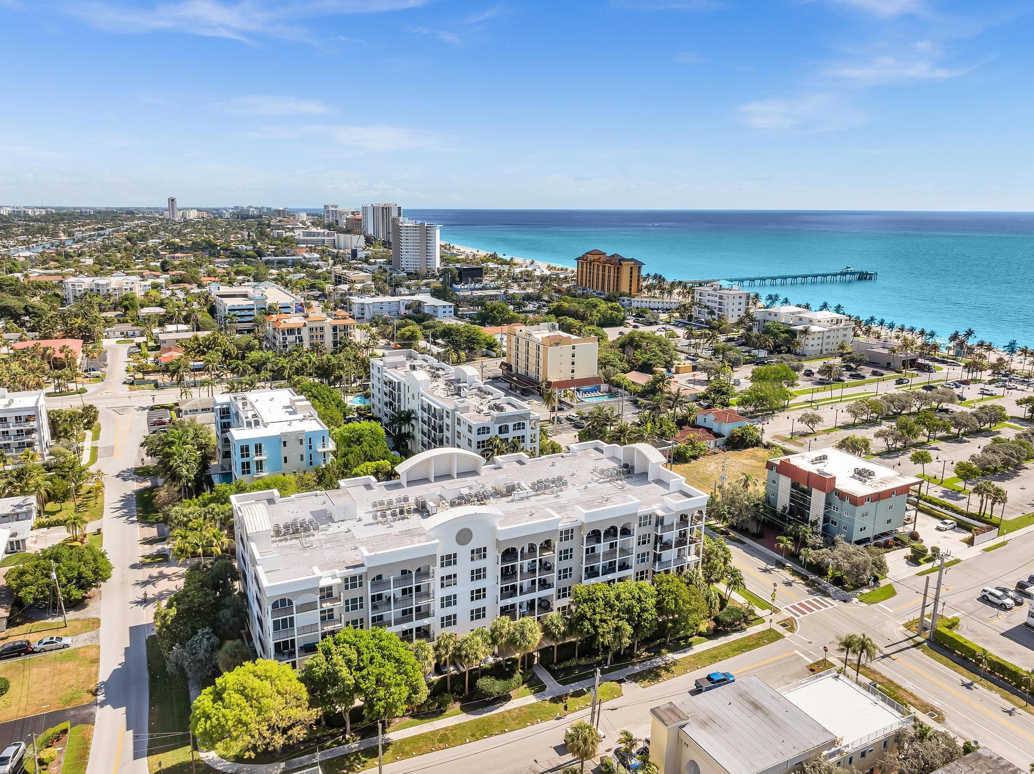 Welcome to Unit 514, Lower Penthouse, in Deerfield Beach's premier Oceanside condominium, 1 Ocean Boulevard! 514 boasts panoramic southern views from all rooms and its unit-wide and deep open air patio.  This spacious patio can accommodate full sized furniture like modular chaise lounges/ottomans and dining sets easily accommodating 8 persons or more. 514 has just been freshly painted throughout and upgraded with brand new, never used, designer GE Profile Appliances, stacked front loading LG Thin Q Steam Washer & Dryer. 514 also has a brand new A/C and $3000 Fuse Panel.  Kitchen water dispenser is equipped with a reverse osmosis filtration system. away from Deerfield Beach's famous ''Curve'' on A1A, with its public beach and sidewalk promenade, fishing pier and features your choice of restaurants with an "Island Vibe" up to beachfront fine dining bistros.  Shopping ranges from "Surf" attire to designer fashions all just a stroll from your new home! 514 comes with 2 assigned, covered parking spaces.  Lounge by the large, private community pool with whirlpool spa or get in a workout in the gym offering the latest modern exercise equipment.