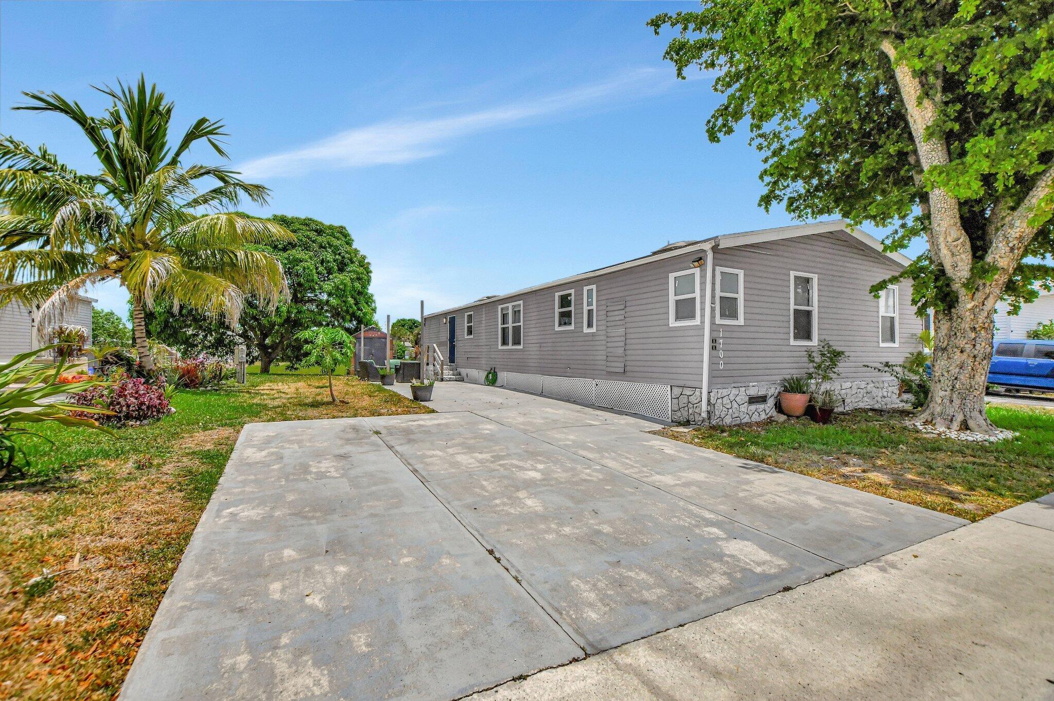 Spacious 4 bedrooms, 2 baths house equipped with hurricane proof impact windows and doors in the desirable town of West Boca Raton. Newly remodeled kitchen with new appliances from 2023. Updated modern bathrooms. New water heater and new AC. Conveniently located close to a vast variety of unique shops and restaurants. Beautiful mango tree and water view. All ages community!