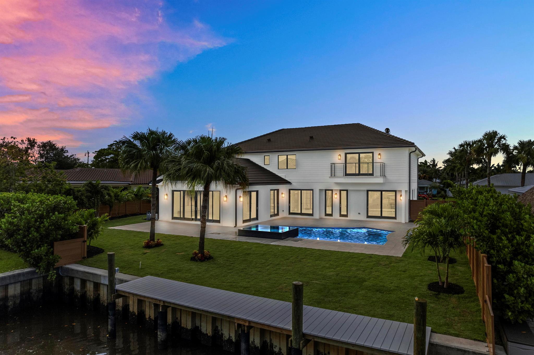 Waterfront CBS 5 bedroom, 6 bathroom pool home offering 60' of private waterfront and a private 34' dock, with ocean access & one 14' fixed bridge. Absolutely gorgeous modern waterfront home located in the desirable Village of Tequesta. No expense was spared on the construction of this impressive residence, with designer selections hand picked throughout the 3,920 sq. ft. of living space and 4,755 Sq. Ft. total. Enjoy the highest quality appliances and fixtures in the massive chef's kitchen, complete with marble countertops, custom cabinetry, and hidden walk-in pantry. The primary suite exudes luxury with a private balcony, a gener amenities; a modern heated saltwater pool with sunshelf and spa, large format marble pavers, and composite dock with electrical and water hookup. 

You can't beat this location, with swift intracoastal access for boating and centrally located to Tequesta's best restaurant and shops, A-rated schools, and amazing parks. Easy access to beaches, highways and airports.