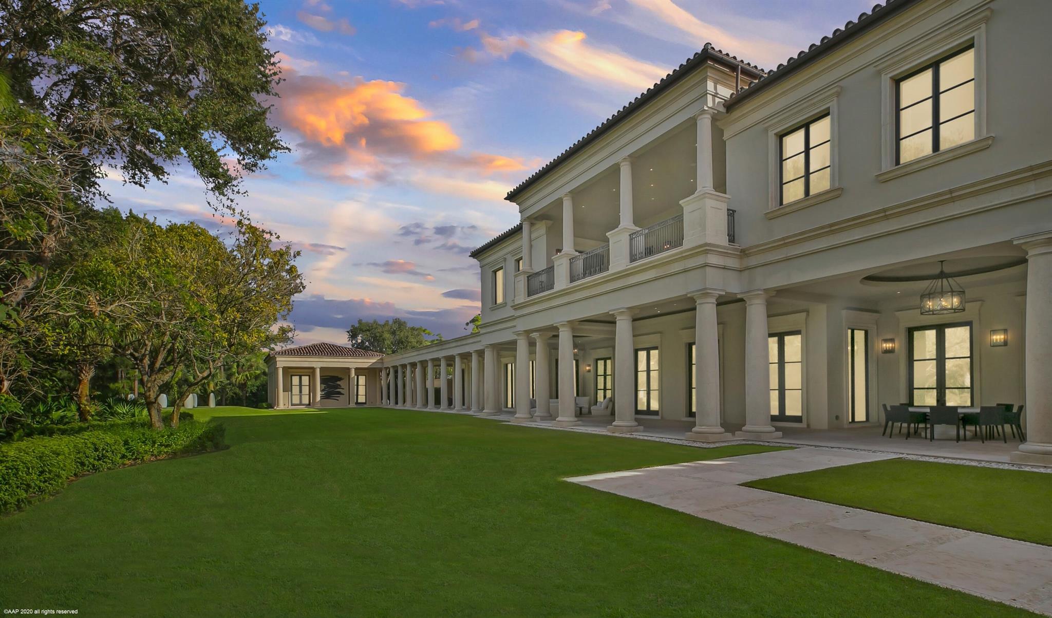 Situated on an oversized double lot in the prestigious Bear's Club located in Jupiter, Florida, this custom Palladian styled estate residence offers 33,705 total square feet with 7 bedrooms, 9 baths and 3 half baths. The property showcases views of the 11th fairway of the Nicklaus signature golf course from its expansive outdoor loggias, galleries, manicured lawn, elegant pool and spa and covered private second floor terrace. This residence was originally designed by Manuel J. Diaz and was built by Lavelle Construction in 2010. The property has been previously featured twice in Architectural Digest. The main house offers bespoke finishes and extraordinary attention to detail throughout including high ceilings and doors, custom moldings and built-ins, marble floors, beautifully proportioned rooms, a full house generator, hurricane impact doors and windows and the most spectacular master suite with a dressing room, safe room, gallery hall and a sensational bathroom that serves as a spa-like retreat. In addition to the main residence the property features a spacious free standing office conveniently located next to the master wing complete with an en-suite bath, walk-in closet and a large gym surrounded by floor-to-ceiling windows showcasing the beautiful garden and golf course views. There is also a separate two-story guest house with an office, two bedrooms and two baths, and a living room, kitchen, and laundry.