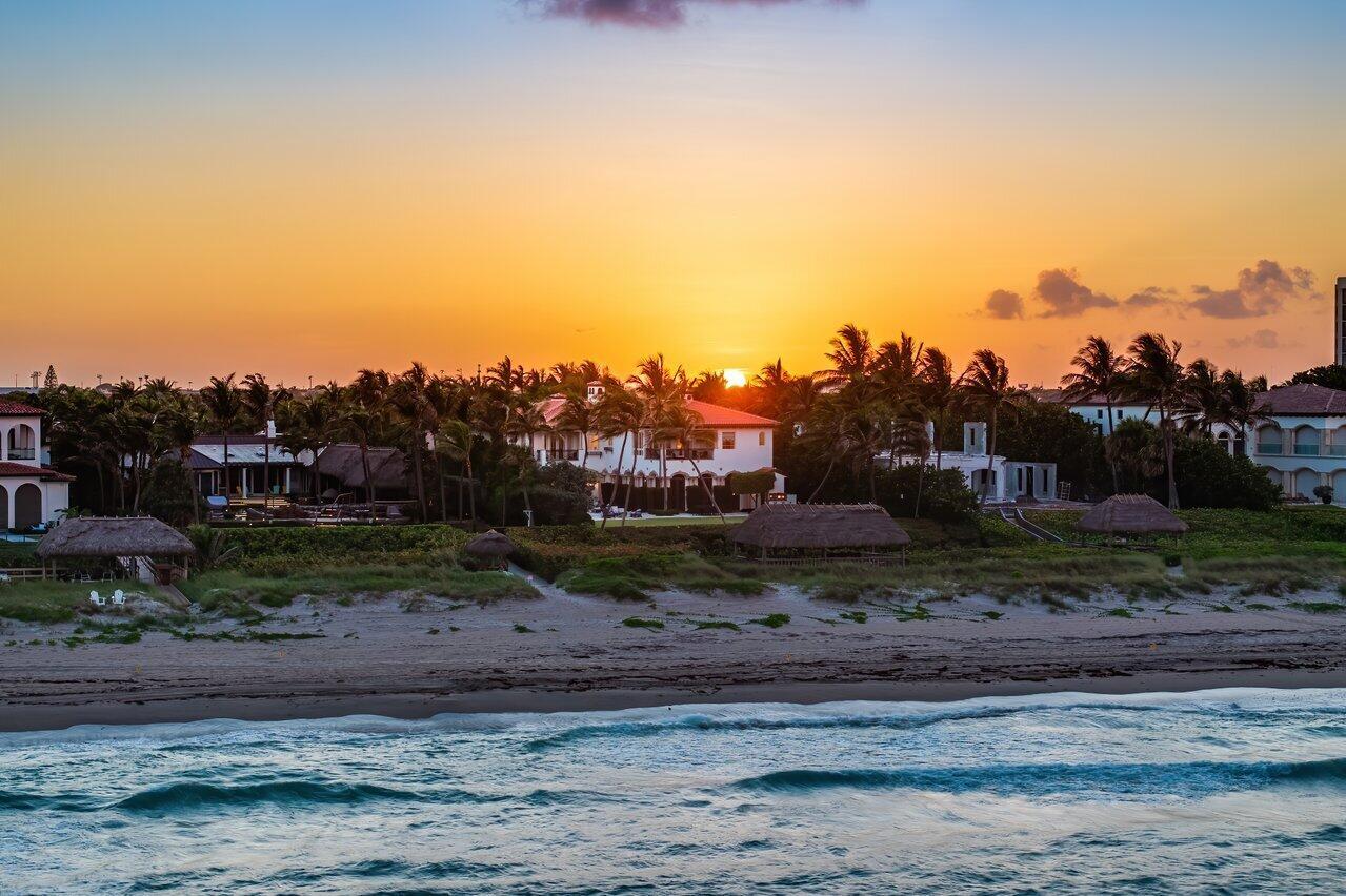 Discover 2367 S. Ocean Blvd Highland Beach, a one-of-a-kind oceanfront estate in the prestigious Byrd Beach section is set on 100 feet of direct ocean frontage with over 600 feet of depth to the water.  This estate spans over 12,400 living sqft, with more than 18,000 TSF. The main residence with a brand new roof offers five luxurious en-suite bedrooms, while a separate guest house with three bedrooms, three baths and a living area with kitchen and dual entrances provides the ultimate flexibility for today's contemporary lifestyle. Designed and built by Dan Swanson, this extraordinary property flawlessly merges timeless elegance with modern sophistication, creating a residence that epitomizes both comfort and grandeur. is a gracious foyer with a sweeping staircase, a large living room with a fireplace, a formal dining room, an ocean-facing office, a clubroom with exquisite millwork, and a full wet bar. A gourmet chef's kitchen featuring a fully equipped butler's room, two large islands, fine custom cabinetry, and top-shelf appliances. Adjacent to the kitchen is a casual dining area and an inviting gathering room with a fireplace, creating an ideal space for indoor family entertainment. The expansive, ocean-facing loggia takes indoor-outdoor living to the next level. Enclosed by elegant French doors, this area offers breathtaking ocean views and is beautifully inspired by the sea. It features a cozy fireplace, a fully equipped bar, and a kitchen, making it the perfect setting for entertaining. The loggia seamlessly merges the comfort of interior spaces with the refreshing ambiance of the outdoors. Close to the kitchen, a private staircase leads to a secluded bedroom suite offering ample storage. This versatile space is perfect for guests or as a private retreat, ensuring comfort and convenience with easy access to the main living areas. Light splashes through the ocean-facing grand primary suite with his and her private spa-like bathrooms, two huge walk-in closets, a sitting area with a fireplace, and a beautiful private balcony with ocean views reaching as far as the eye can see. The main house offers three additional bedroom suites, and a large sitting area with a fireplace to complete the second floor. A remarkable and highly sought-after separate guest house offers unparalleled flexibility and luxury. It features dual entrances, allowing it to function as two distinct guest houses. One side includes a bedroom and bath, while the other side boasts two bedrooms, two baths, a living area, and a kitchen. Alternatively, the spaces can connect to create a spacious guest retreat with three bedrooms, three bathrooms, and a combined living area with a kitchen. This unique configuration provides exceptional accommodation options for guests, ensuring privacy and comfort on this oceanfront compound. The sprawling, abundantly landscaped grounds, a fundamental element of what makes this property a singular example of a place to relax and contemplate, offers serene gardens, tranquil pathways, and breathtaking ocean views, creating an idyllic sanctuary for unwinding. Additional features include a five-car garage, a motor court, a full-house generator, and an elevator. Enjoy the Tiki Hut right on the sand, a large pool and spa, and a summer kitchen, all offering ample space for play and entertain. Visit and be inspired to live the perfect South Florida lifestyle, with proximity to Atlantic Avenue, international airports, fine dining, and boutique shopping.